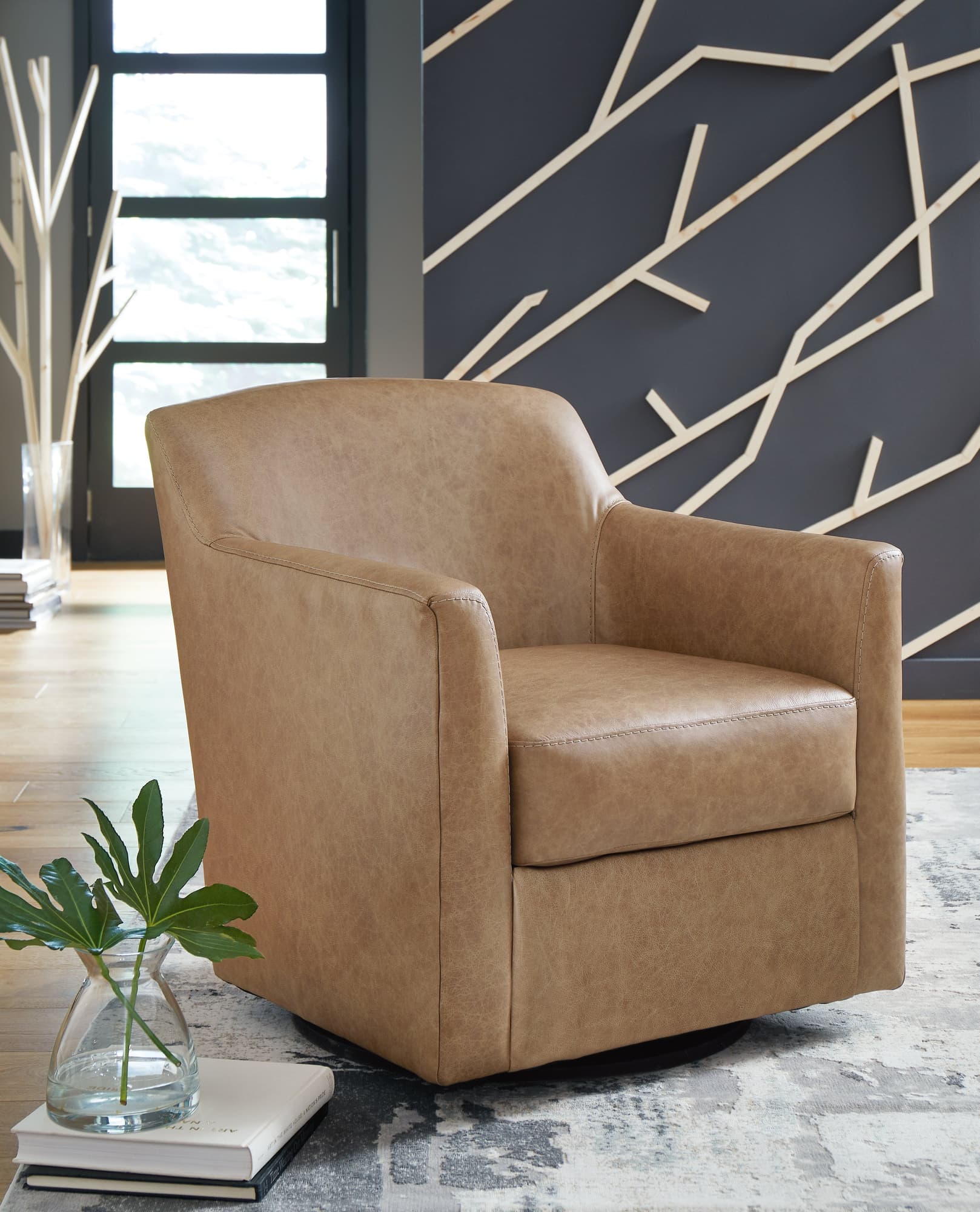 Bradney Tumbleweed Swivel Accent Chair front angle view with leather upholstery