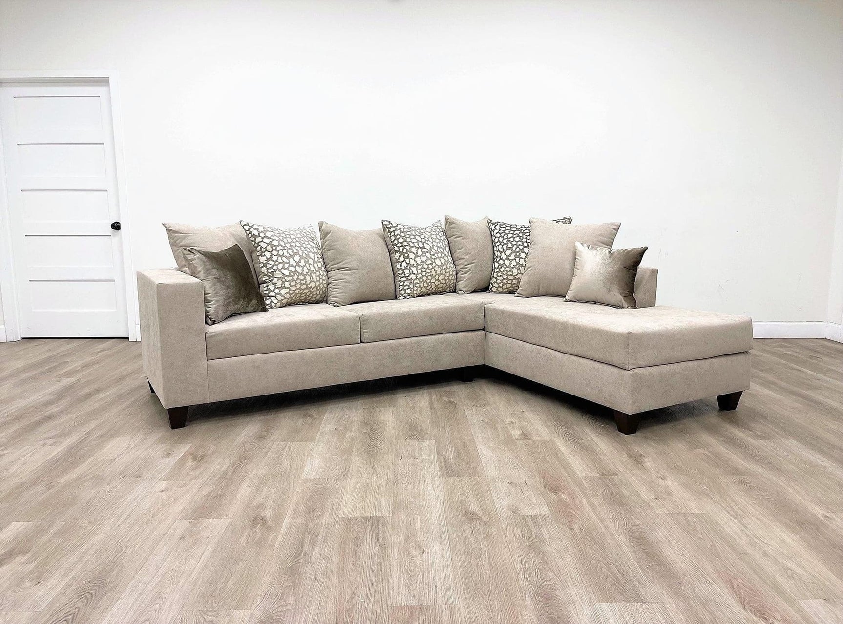 Beige chenille fabric upholstered sectional sofa, main front view