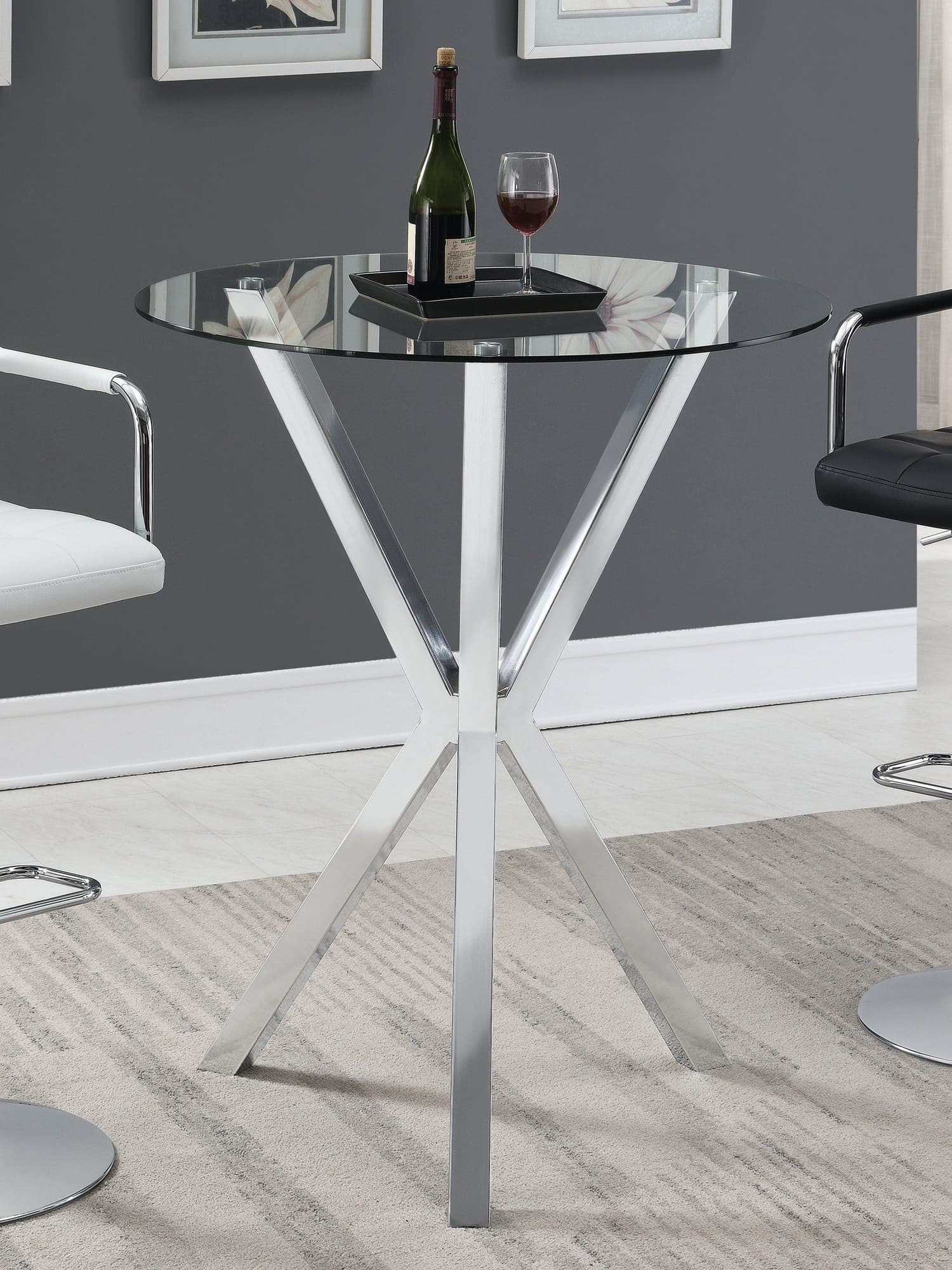 Denali Round Chrome Bar Table with clear glass top, angled view