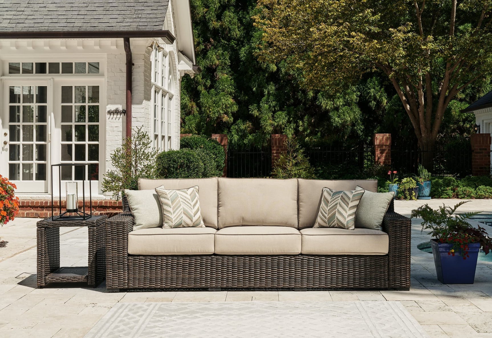 Coastline Bay brown outdoor sofa angled view