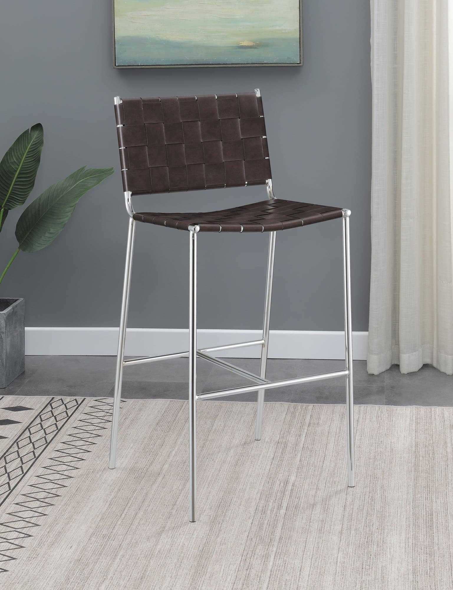 Adelaide upholstered bar stool side view showing brown leatherette and chrome legs
