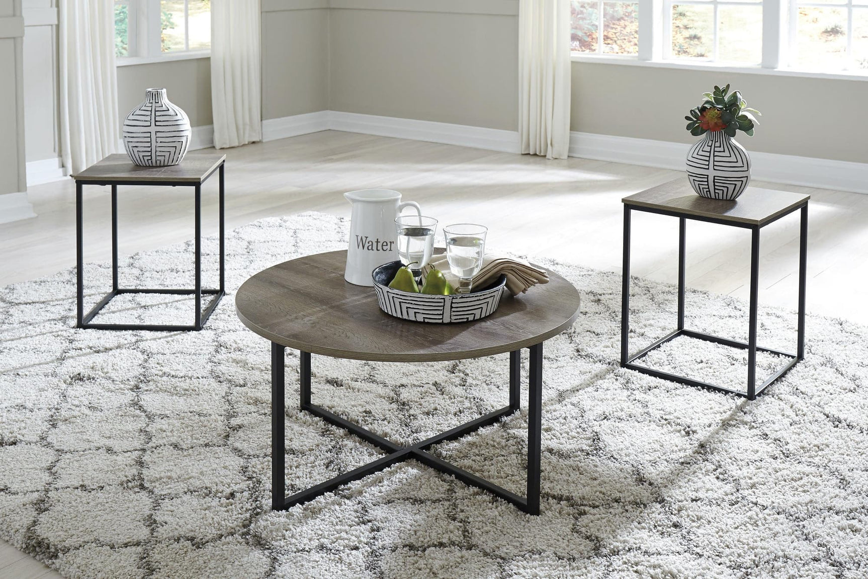 Wadeworth modern two-tone cocktail table with black wood and metal frame, front angle
