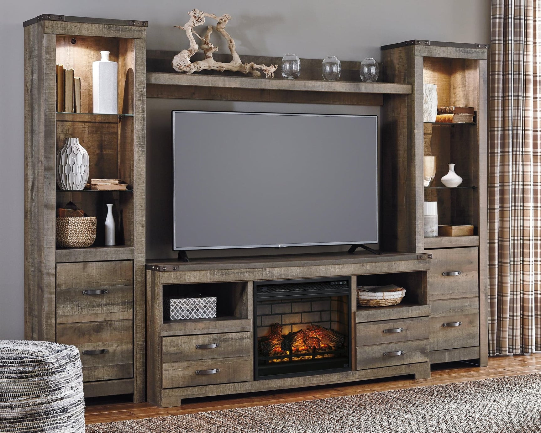 Trinell Brown 4-Piece Entertainment Center with Electric Fireplace front angle