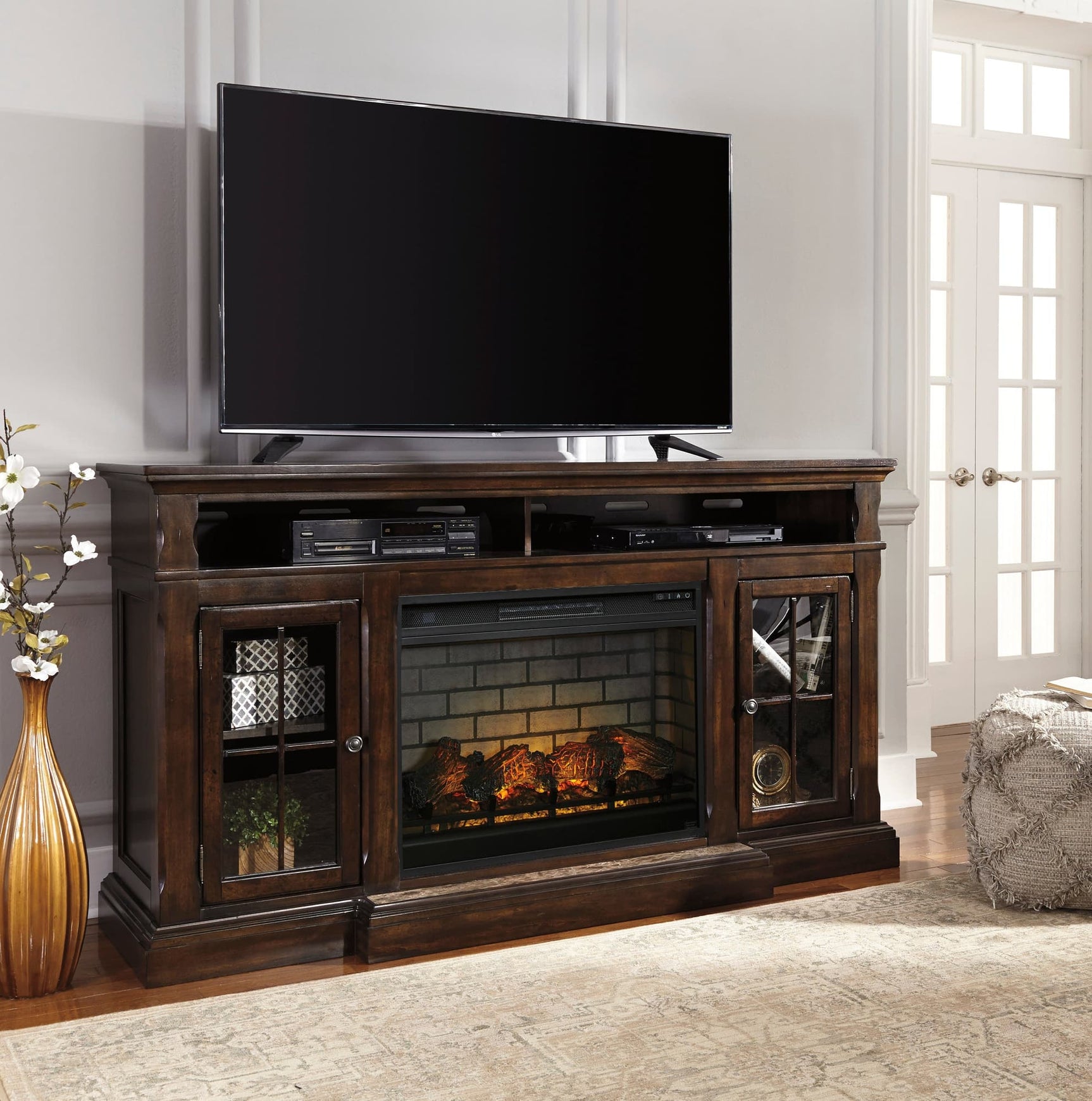 W701-88 TV stand with fireplace, front angle showing tempered glass doors and shelves