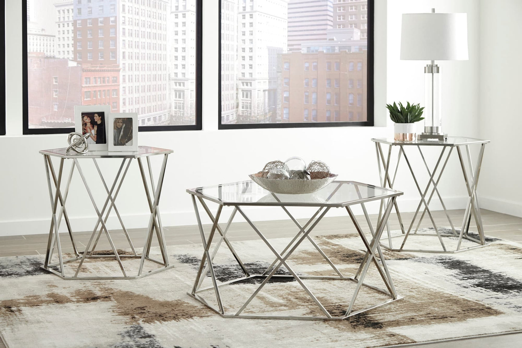 Madanere occasional tables set with chrome finish showing cocktail table and two end tables