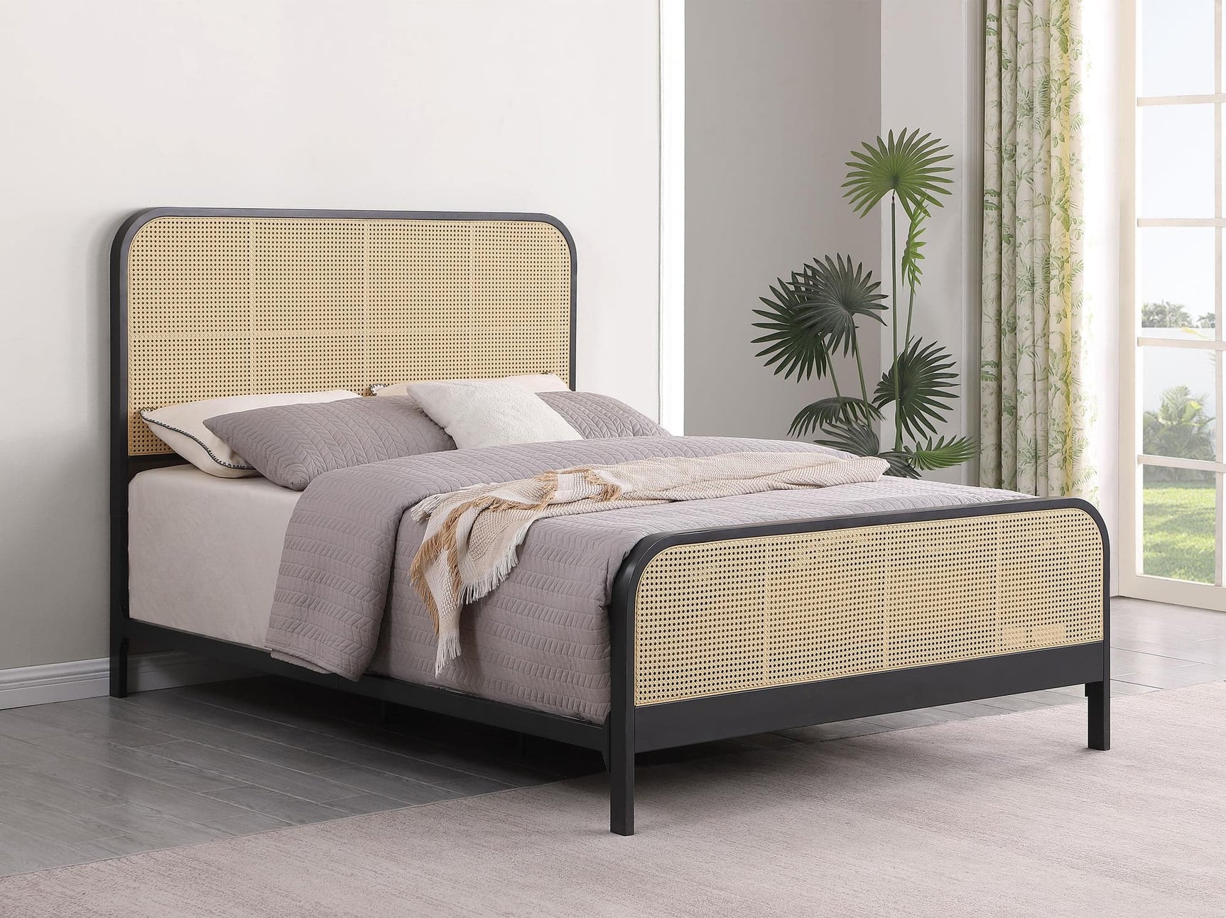 Lanewood black metal king bed front view with rattan upholstered headboard