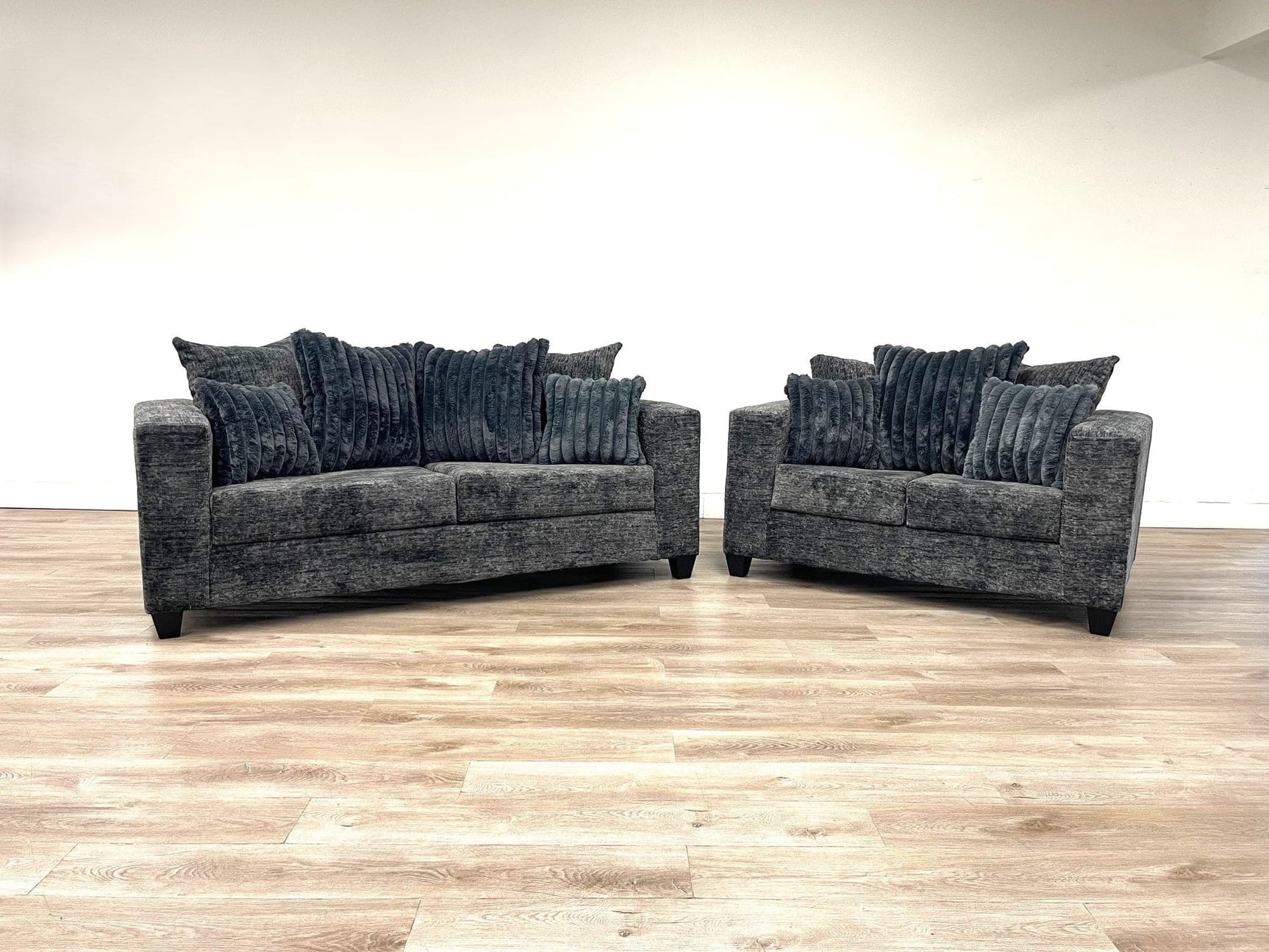 front view of Kaf Charcoal sofa and loveseat set