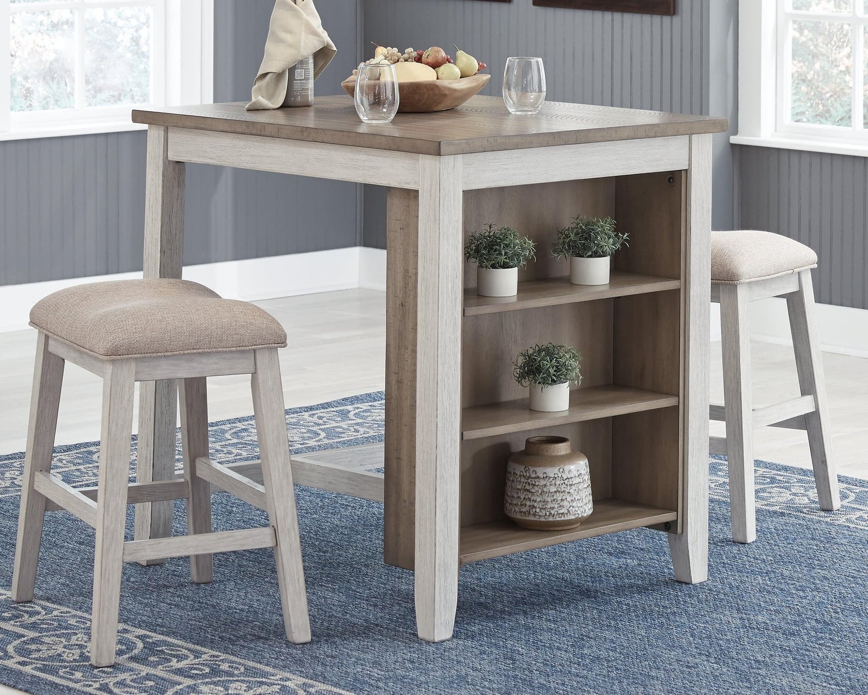 Skempton counter height white and light brown dining table and two bar stools set front view
