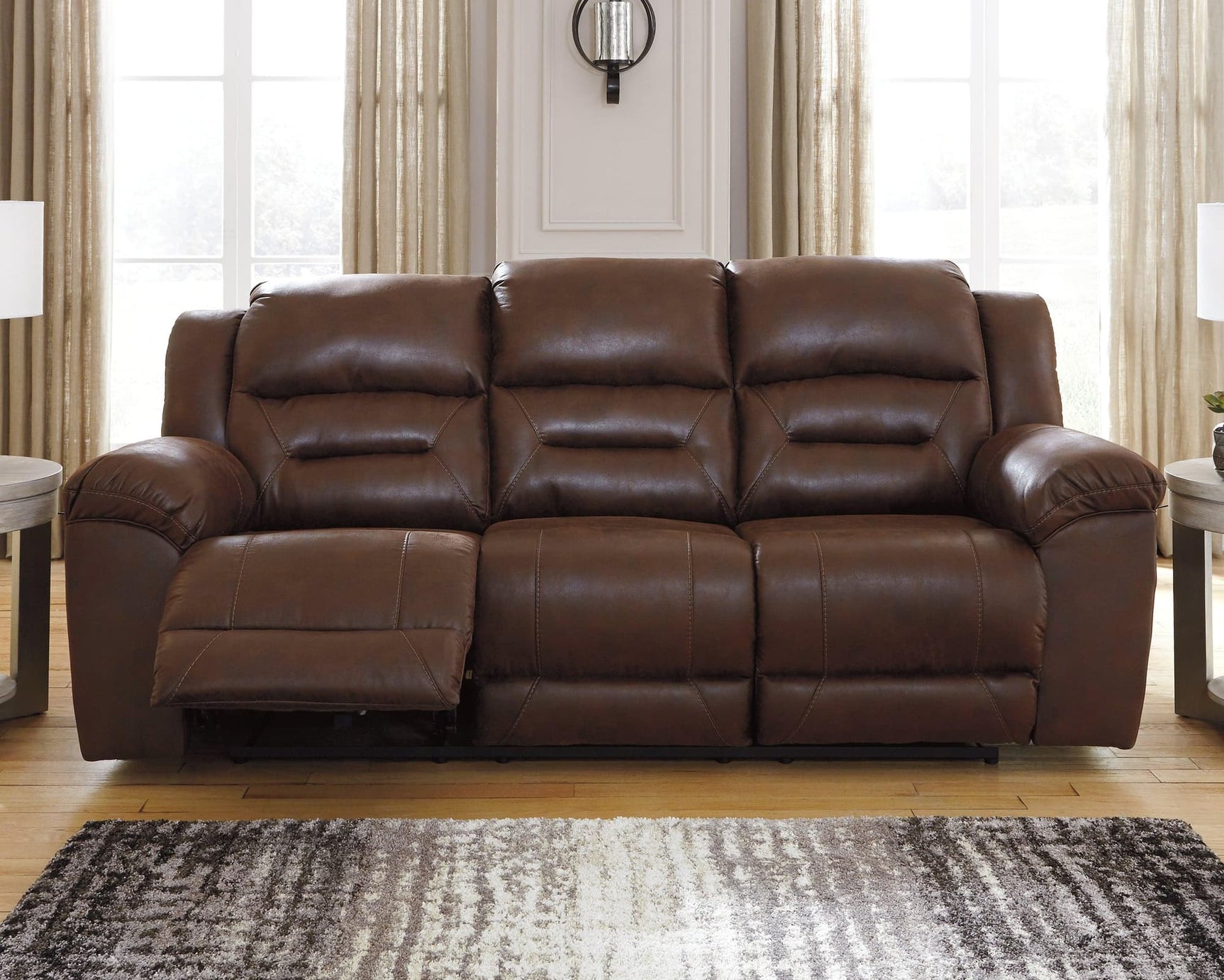 Stoneland Chocolate Faux Leather Power Reclining Sofa angled side view