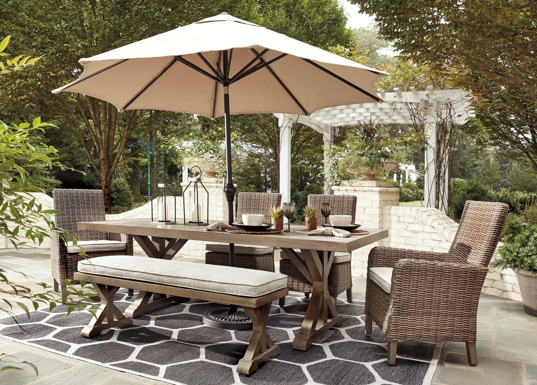 Beachcroft Beige Outdoor Dining Table from front angle