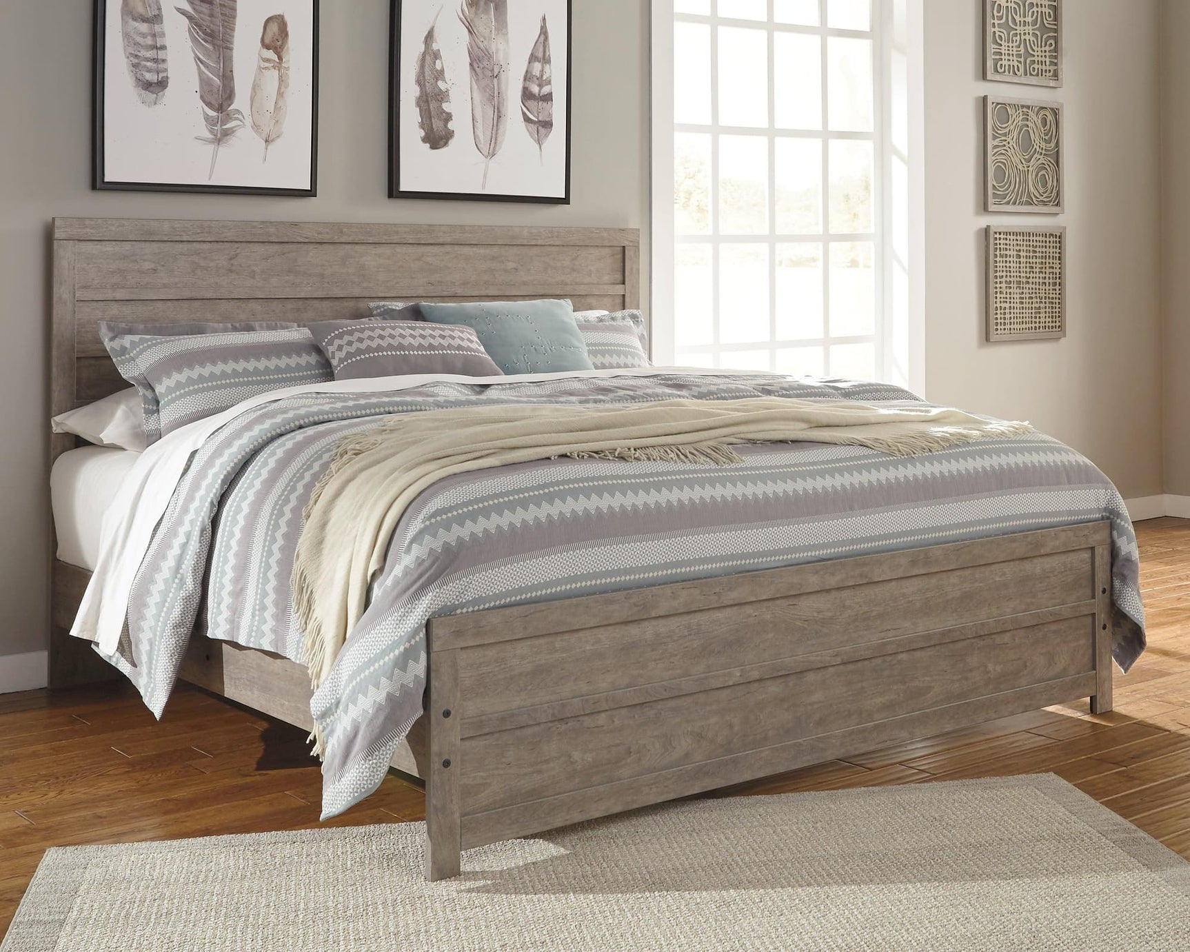 Gray finished Culverbach king panel bed with storage drawers front view