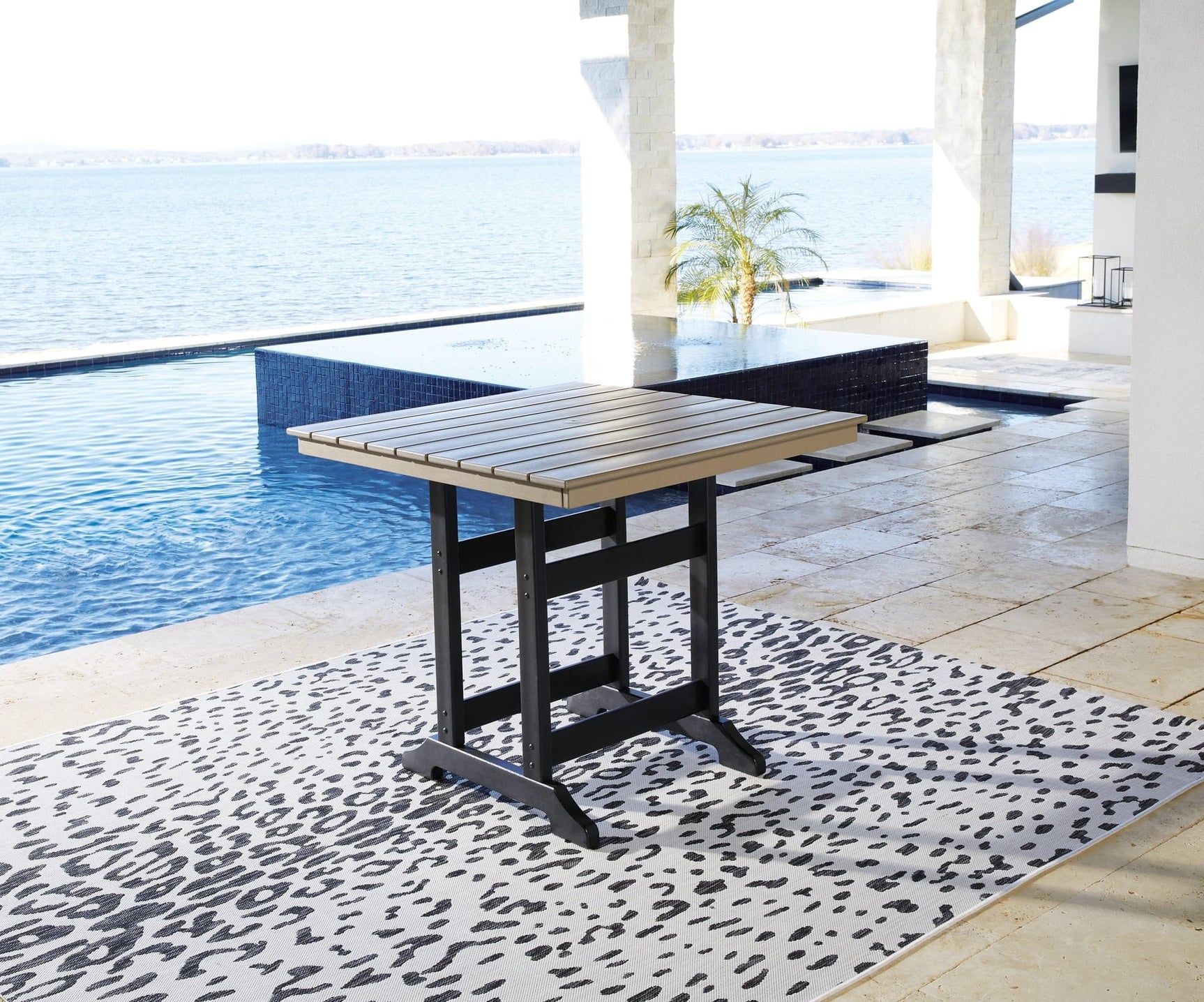 Fairen Trail Outdoor Counter Height Dining Table front angle view in black and driftwood