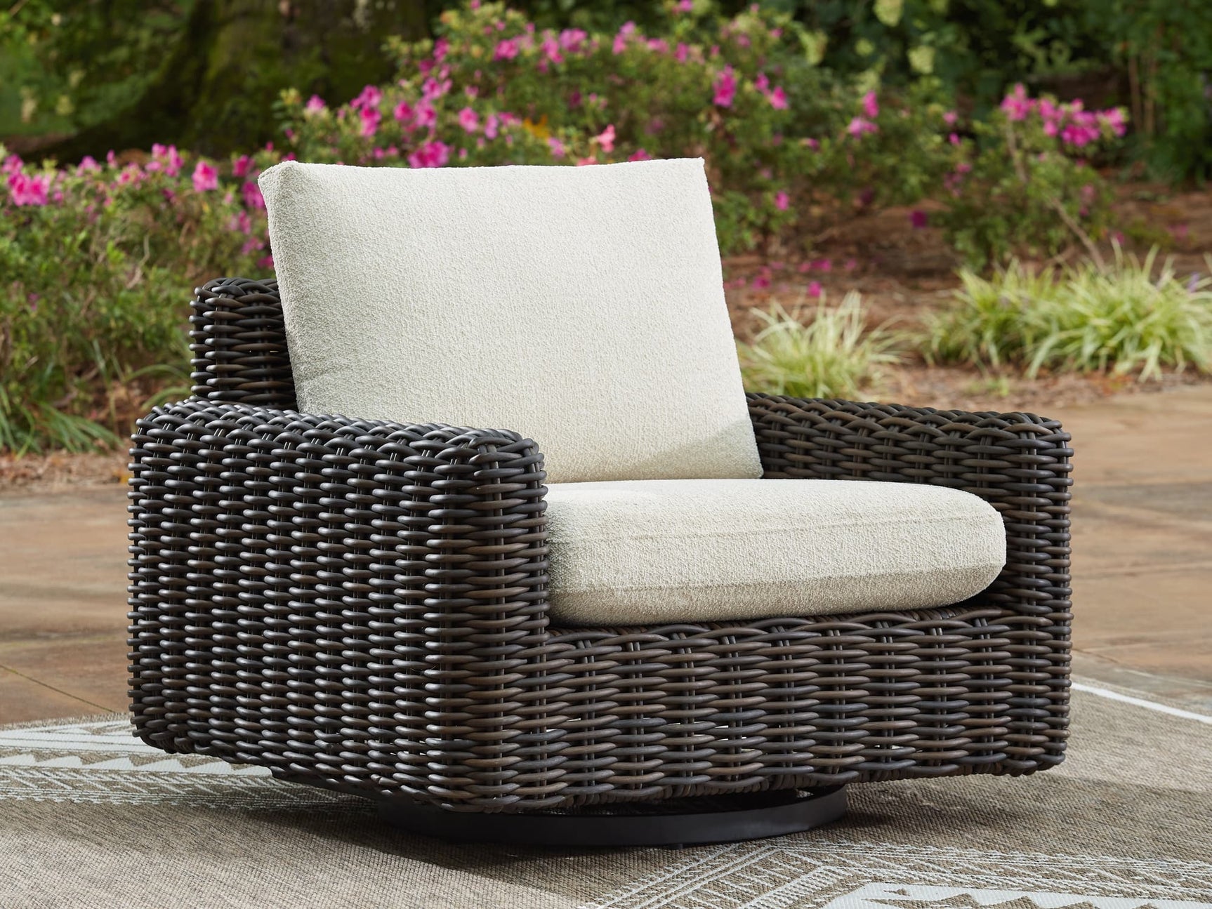 Kimora Beige and Dark Brown Outdoor Swivel Lounge Chair angled view