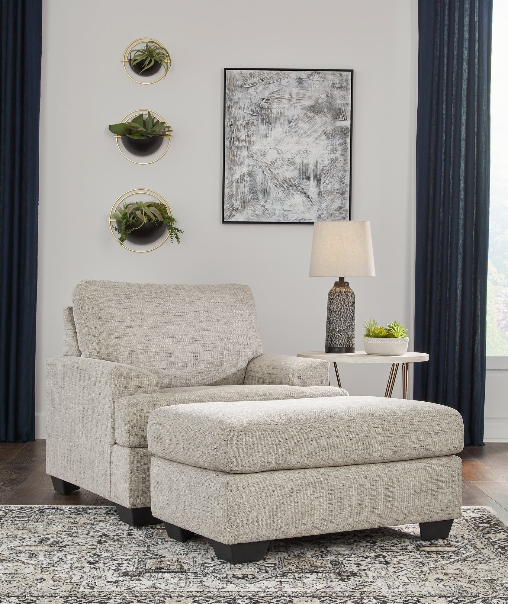 Vayda Pebble Chair and Ottoman set front view