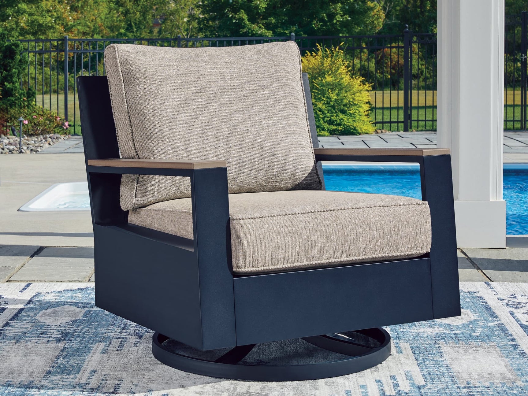 East Beach Outdoor Swivel Glider Chair in Navy Blue with Driftwood Finish, front angle