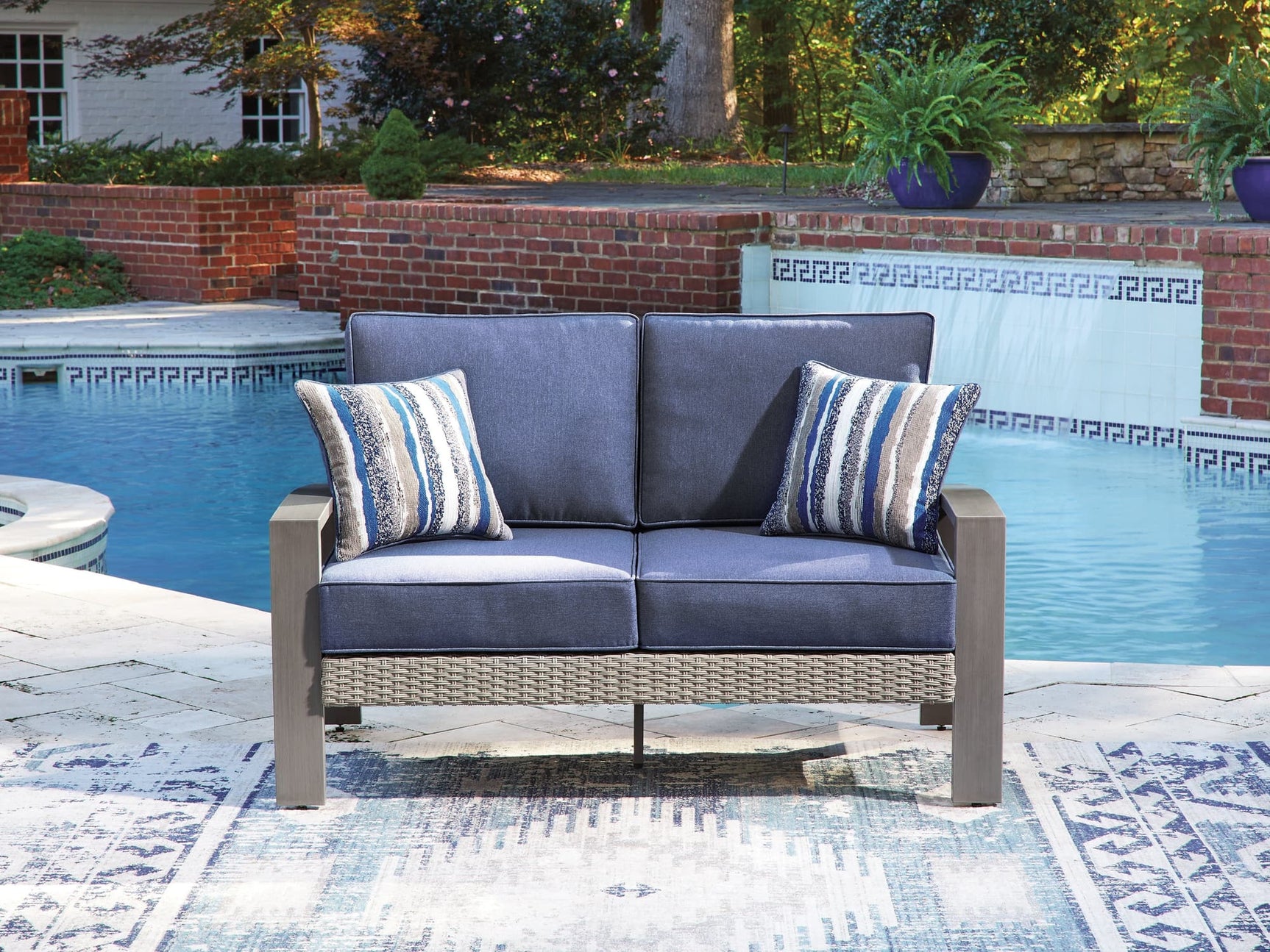 Half Moon Beach blue/gray outdoor loveseat with cushion front angle