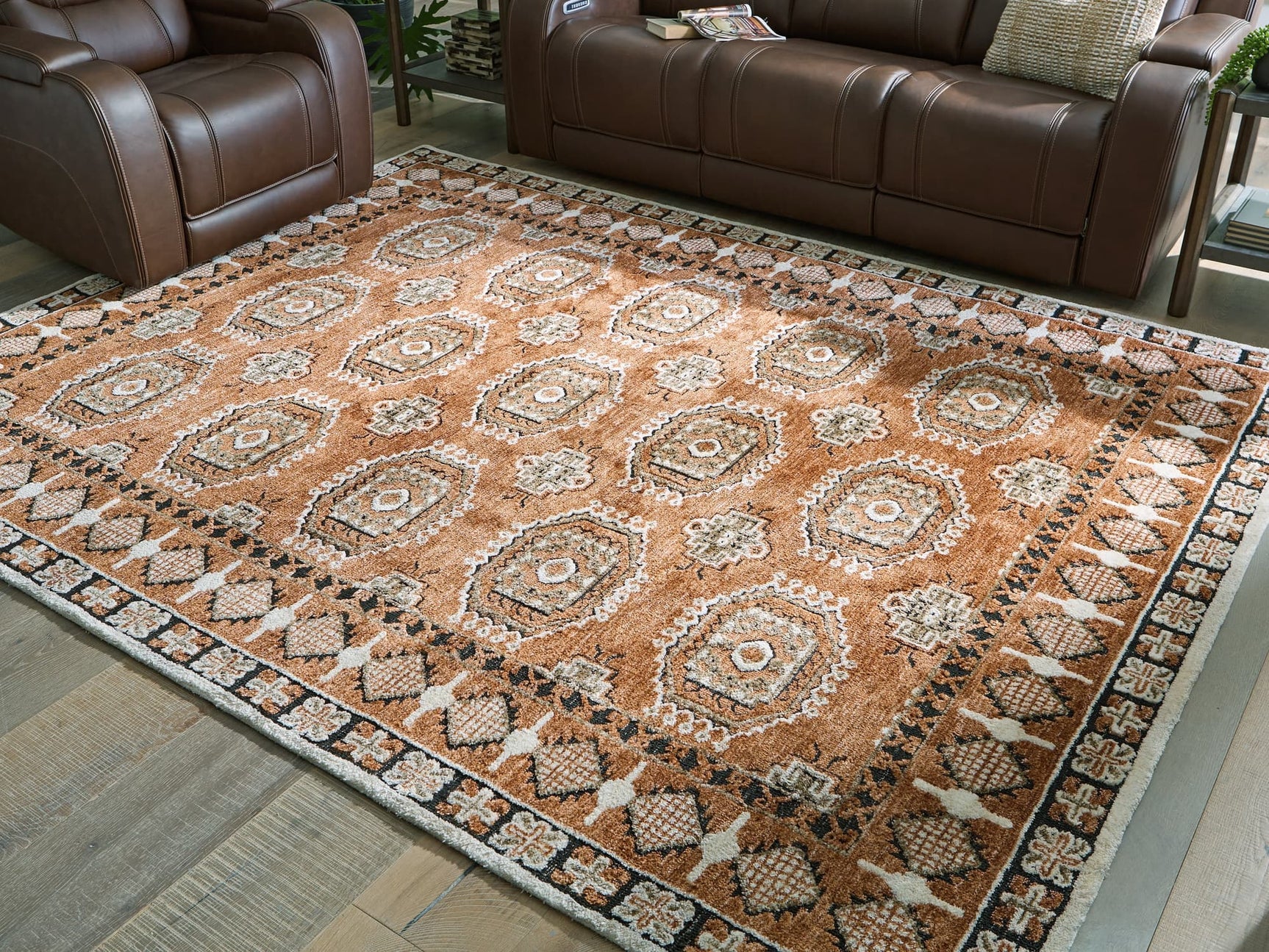 Qaabiz 7'8" x 10' area rug in sienna, ivory, and black medallion pattern