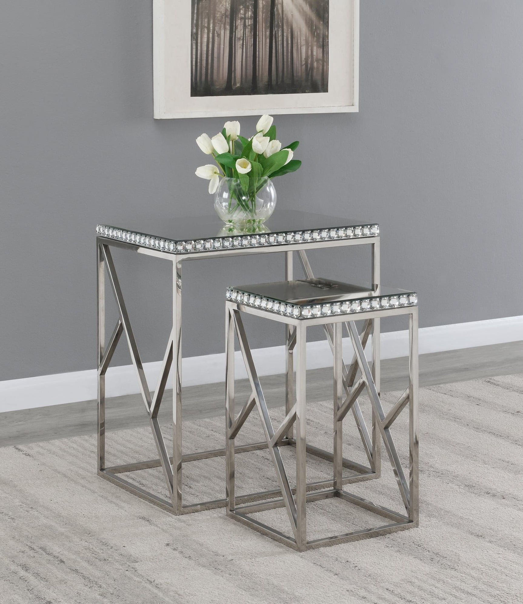 Betsy 2-Piece Silver Mirror Top Nesting Tables - angled view showing mirrored tops and geometric base