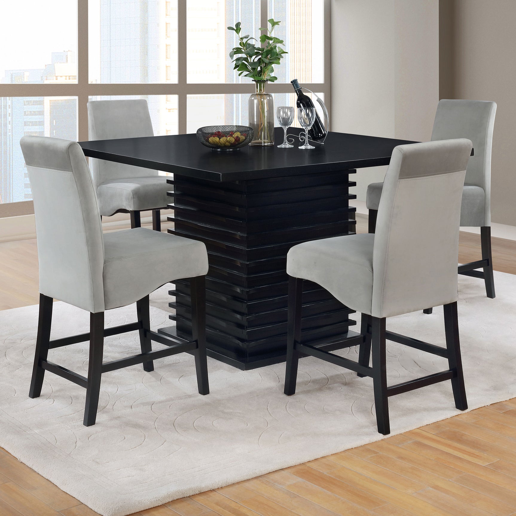 Detail of Stanton dining set black table and gray upholstered chairs