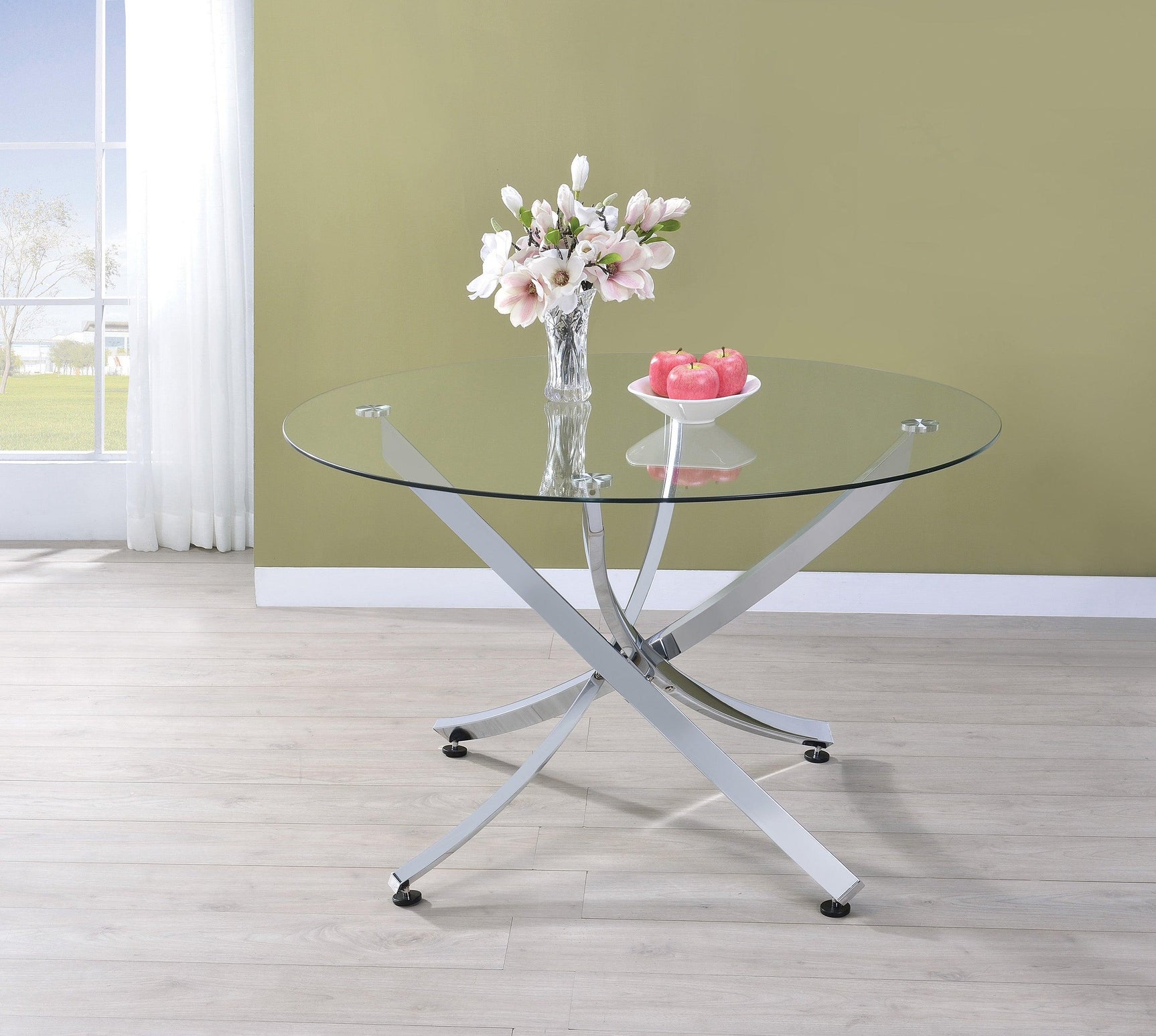 Dining room setup with Beckham Chrome and Clear Round Dining Set