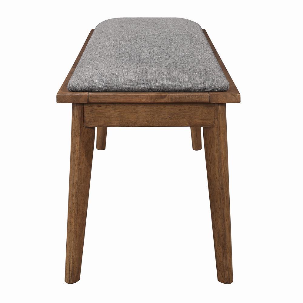 Close-up of grey upholstered seat on Alfredo Dining Bench