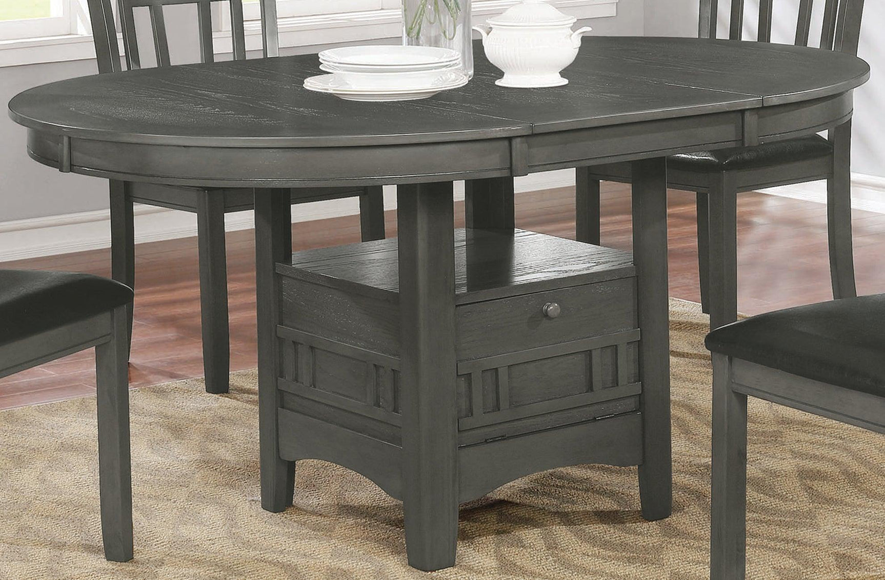 Room view of Lavon Oval Dining Set with four black leatherette chairs