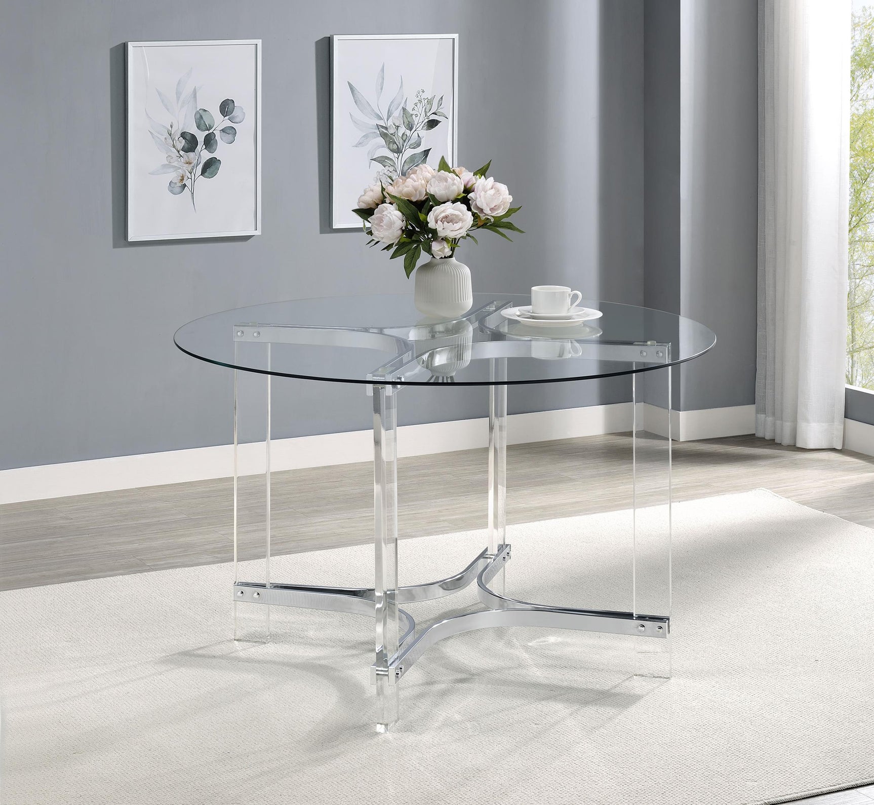 Adino dining table side angle showing acrylic and chrome materials