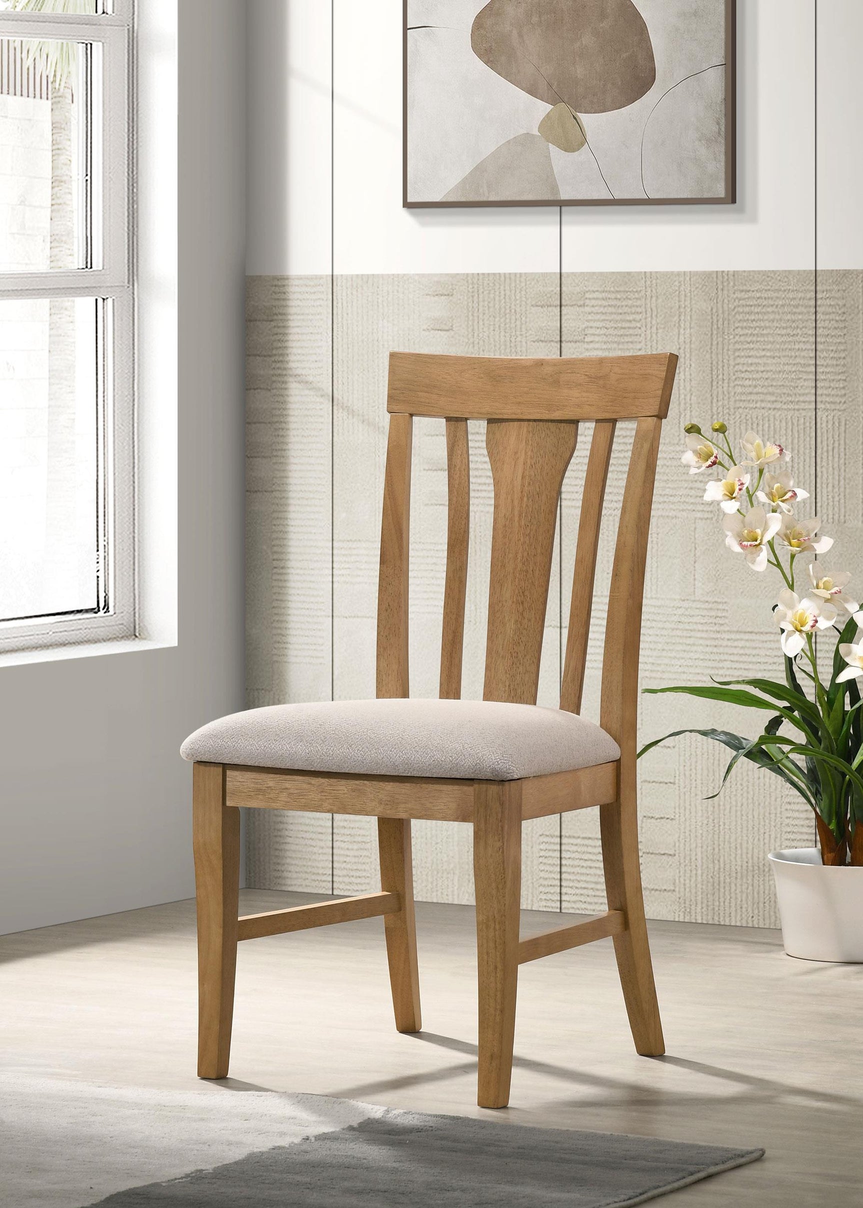 Side angle of Hartville dining side chair showing wood frame and fabric seat