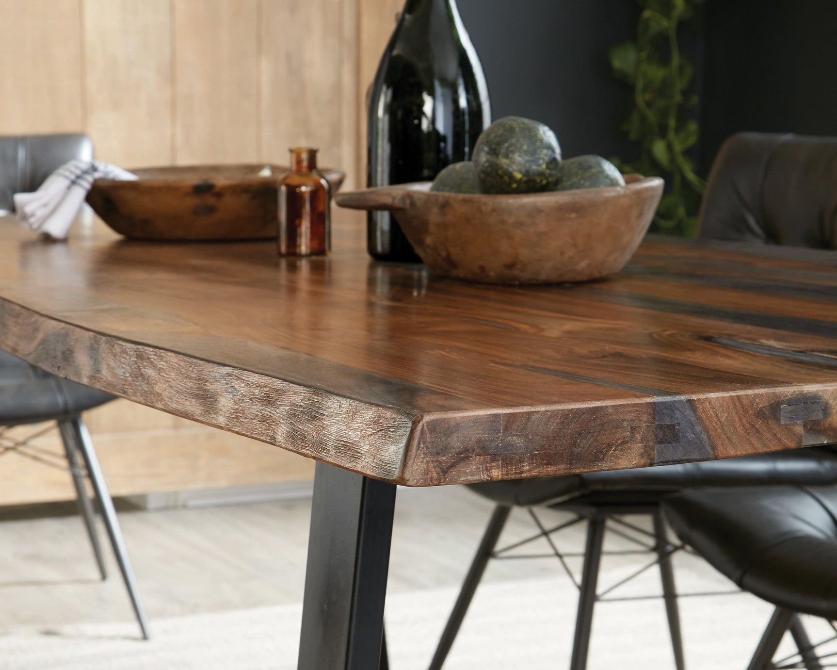 Ditman dining table with four drawers under tabletop, black iron base visible