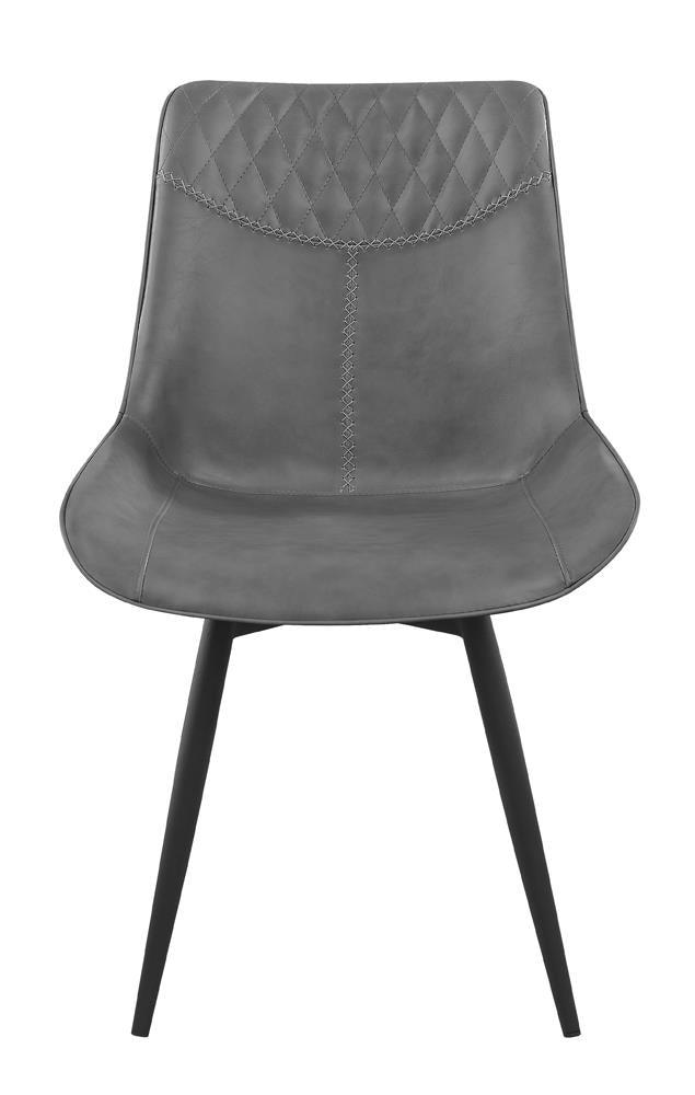 Close-up of quilted detailing on Brassie dining chair back in grey
