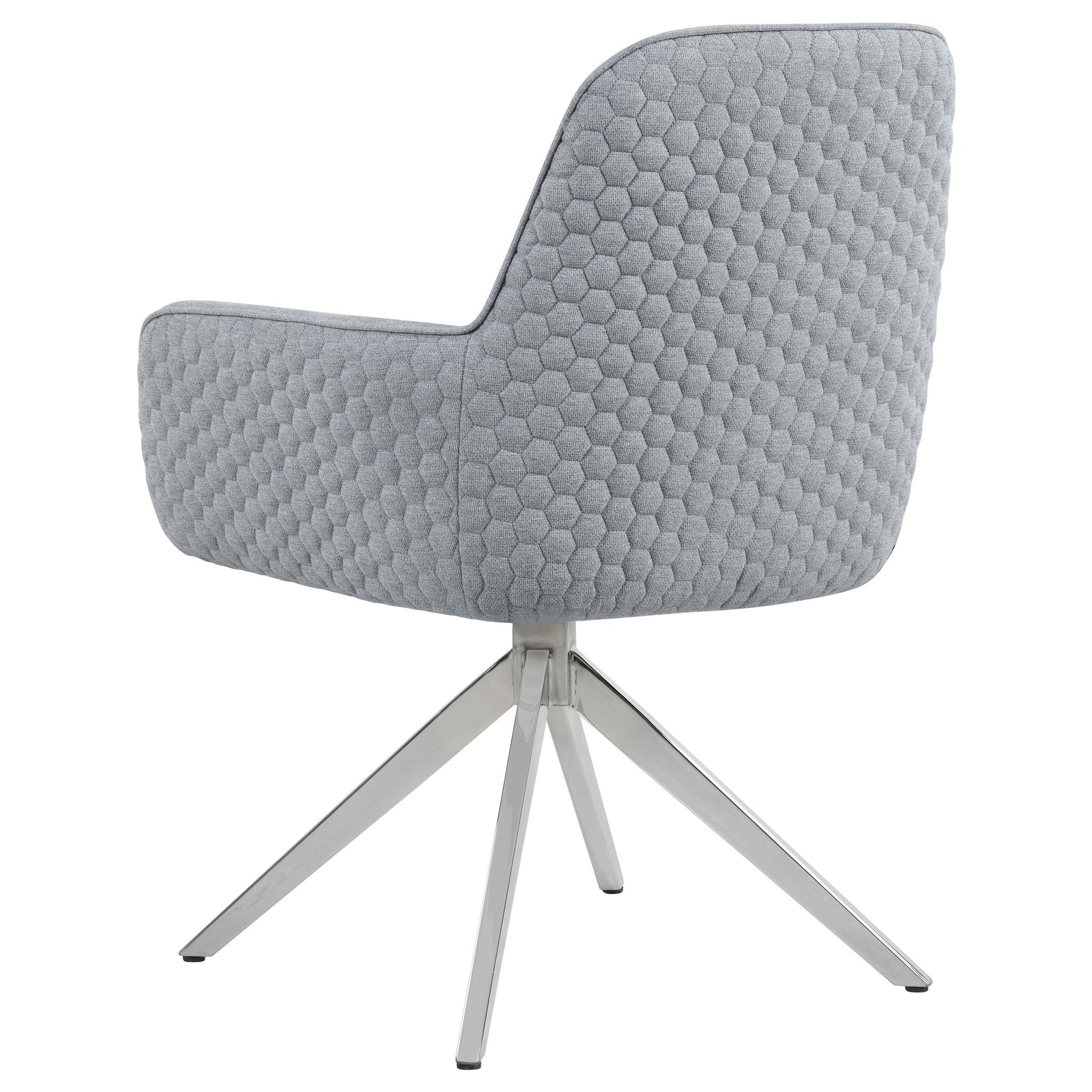 Side angle of Abby swivel chair with honeycomb quilted upholstery