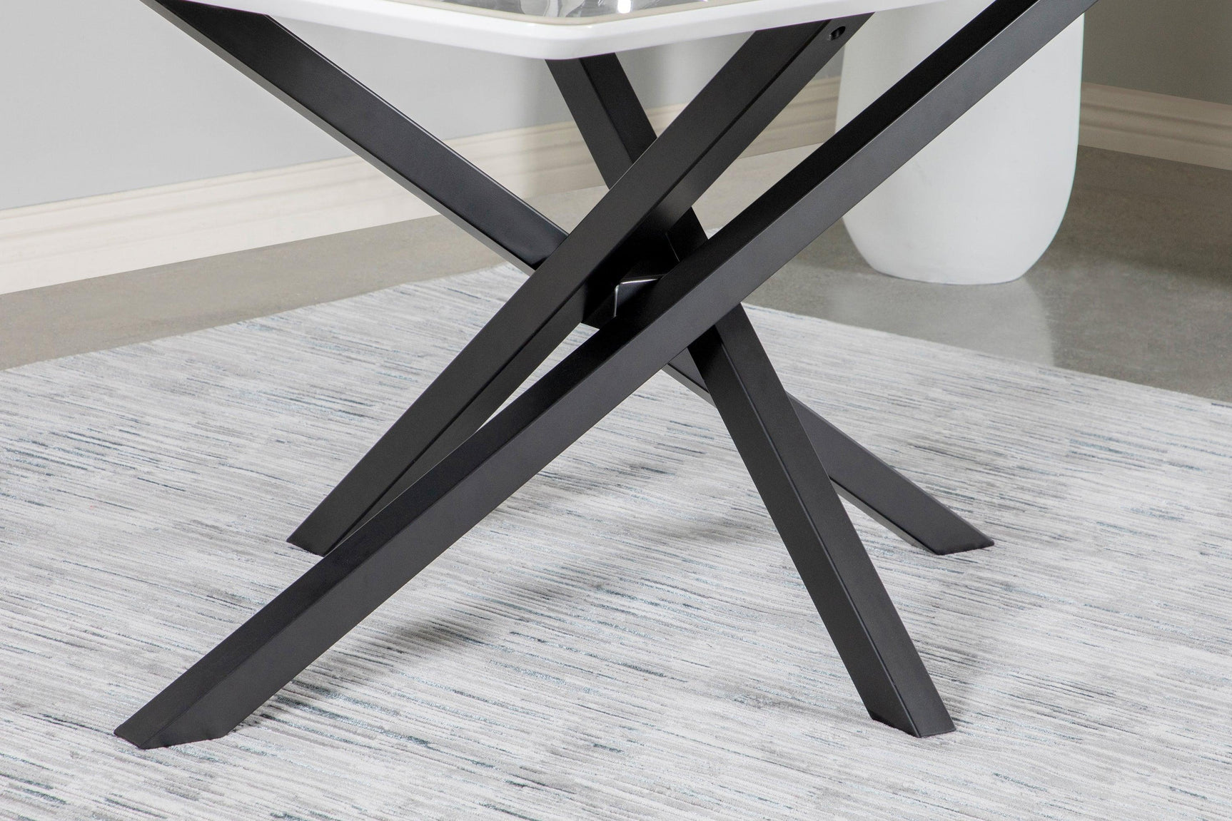 Room view with white ceramic table top and gunmetal base