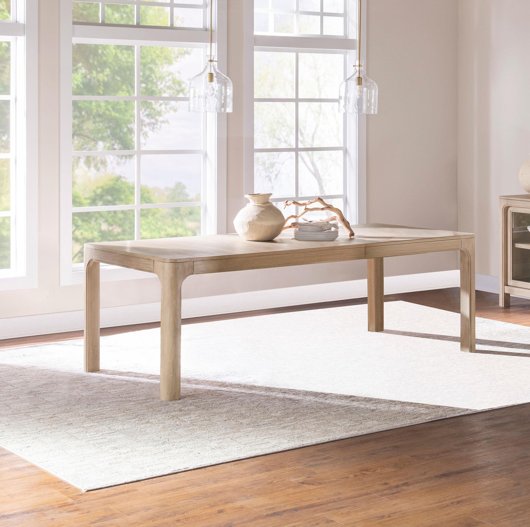 Solano dining table showing curved legs detail