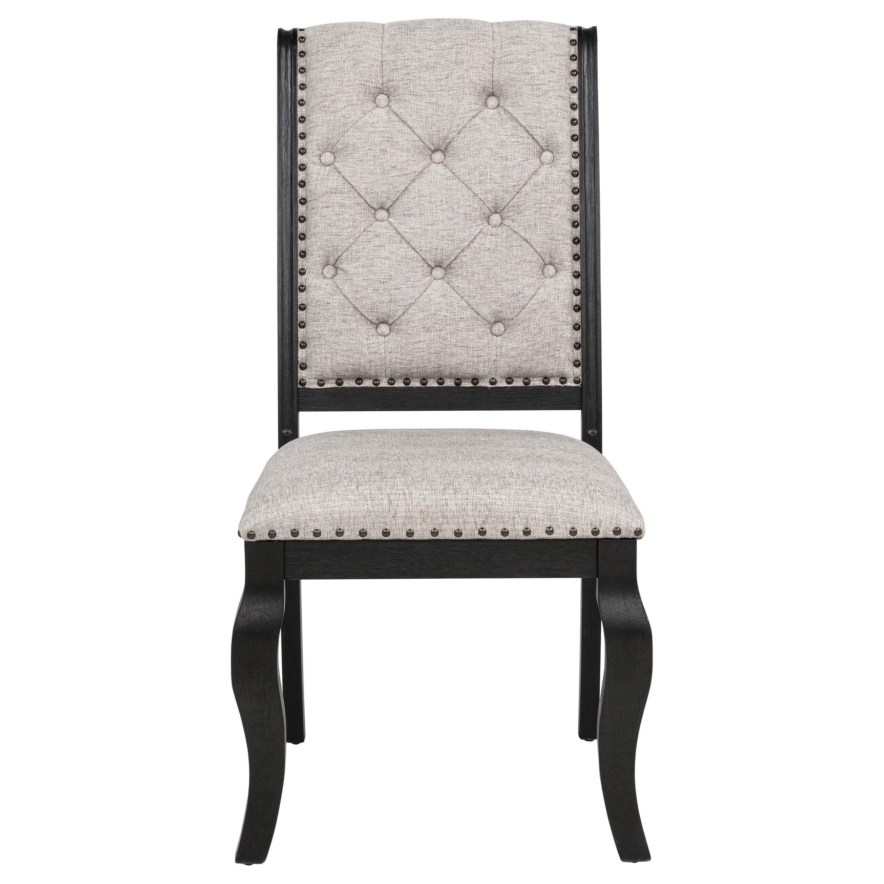 Close-up of tufted chair back with bronze nailhead detail
