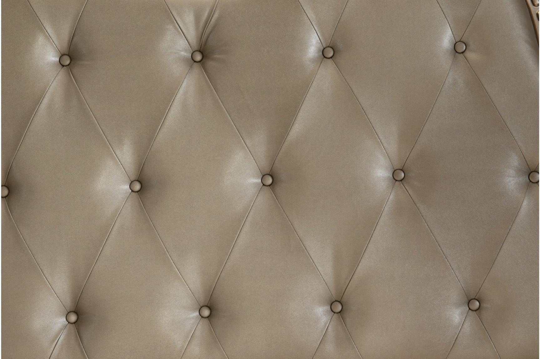 Close-up of tufted faux leather headboard