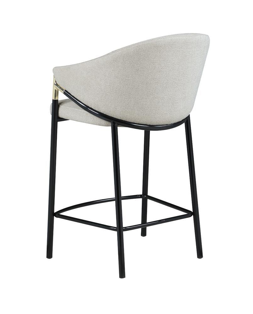Detail of glossy black metal legs with levelers on Chadwick stool