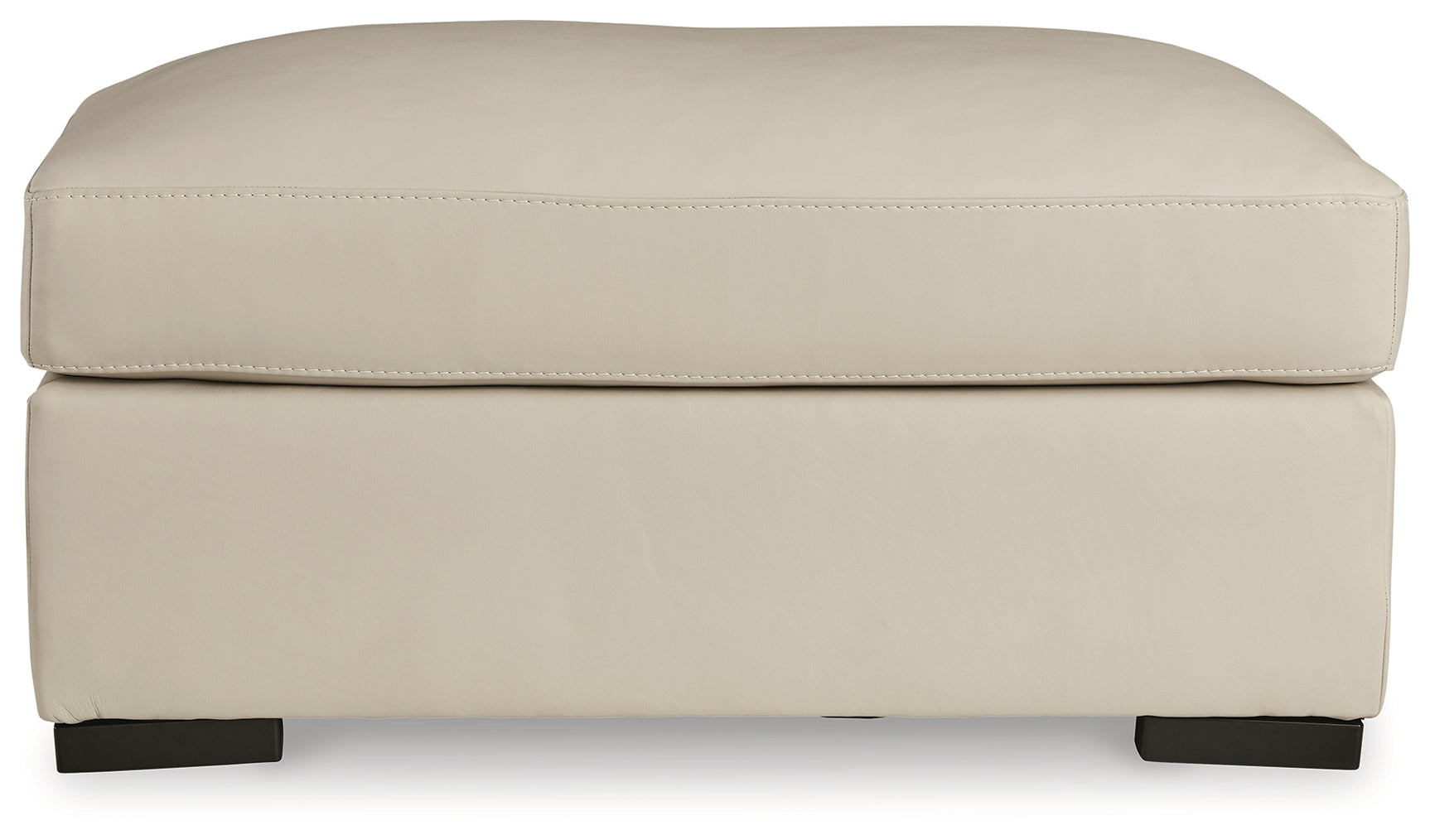 Treasure Trove Ottoman head-on view almond leather cushion