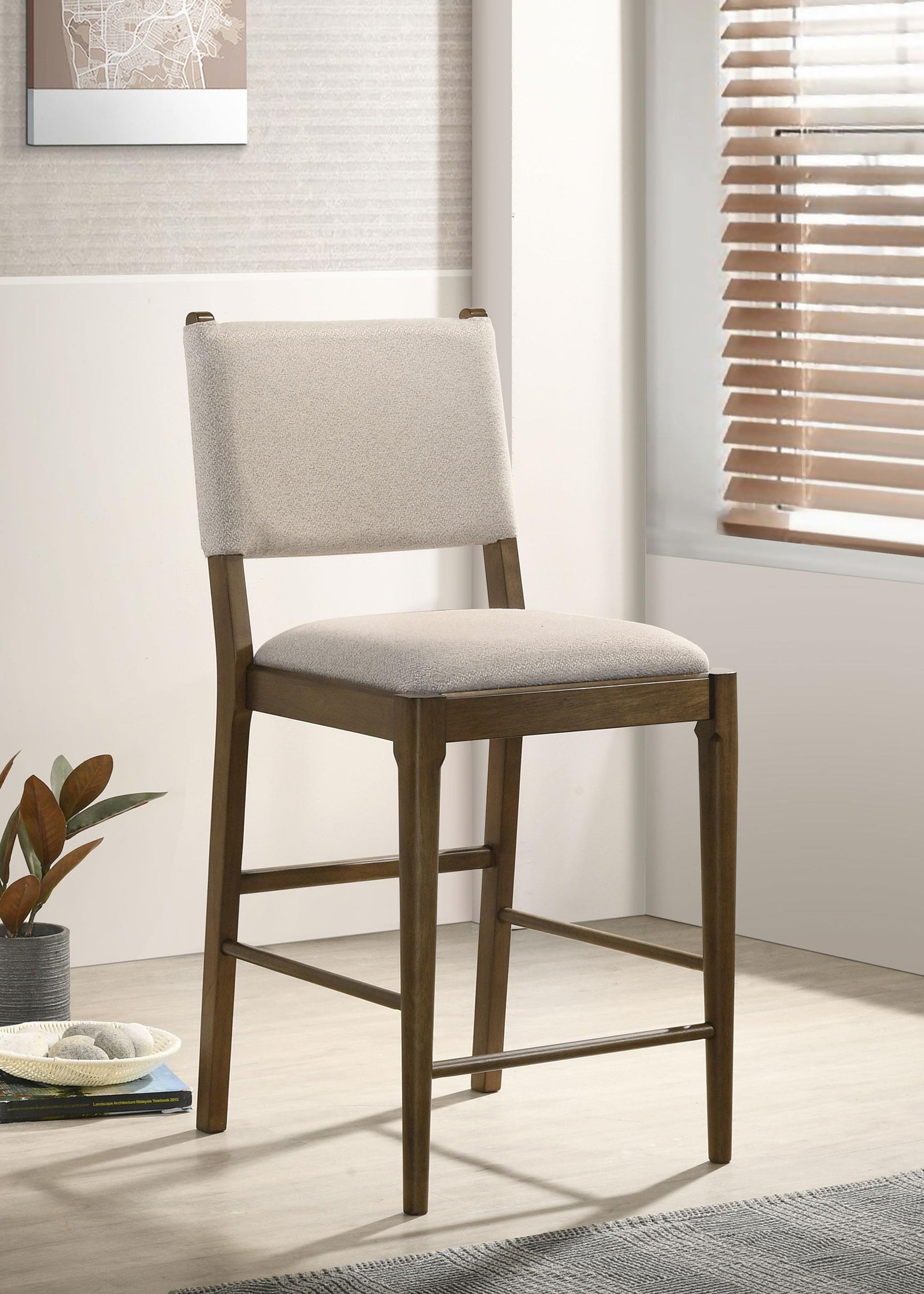 Side view of Ottowa counter side chair highlighting fabric upholstery