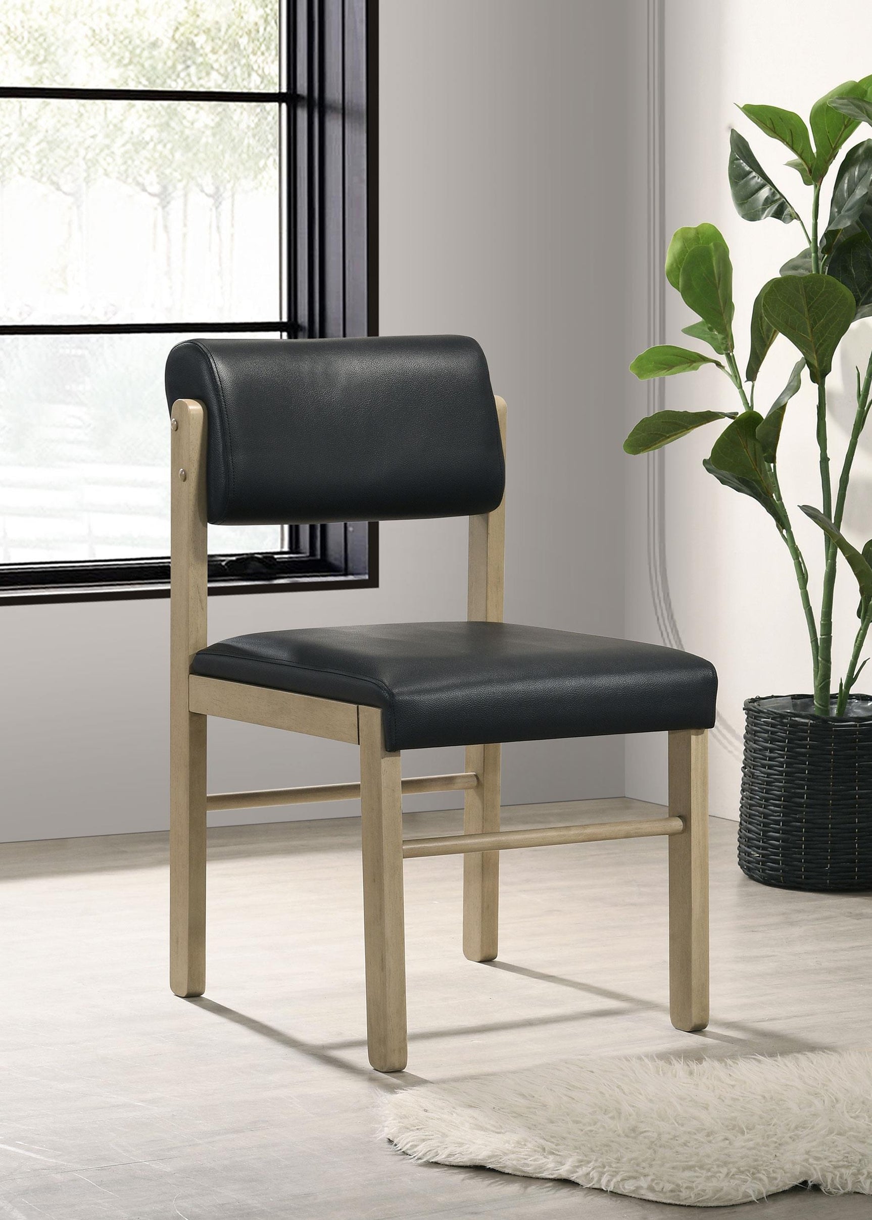 Kehoe Dining Chair side view showing curved backrest and cushioned seat