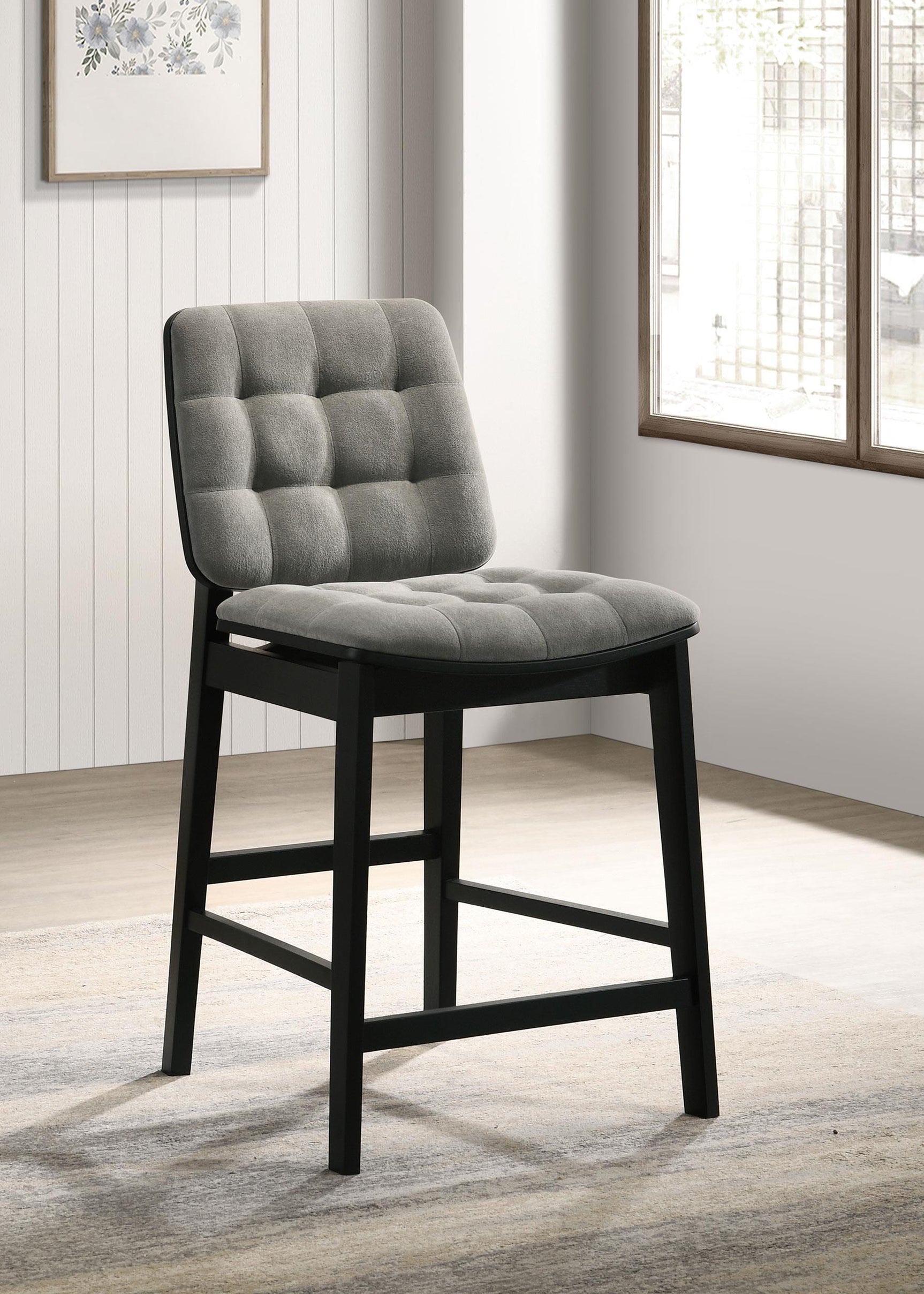 Redbridge counter chair side angle showing grey velvet upholstery and black legs