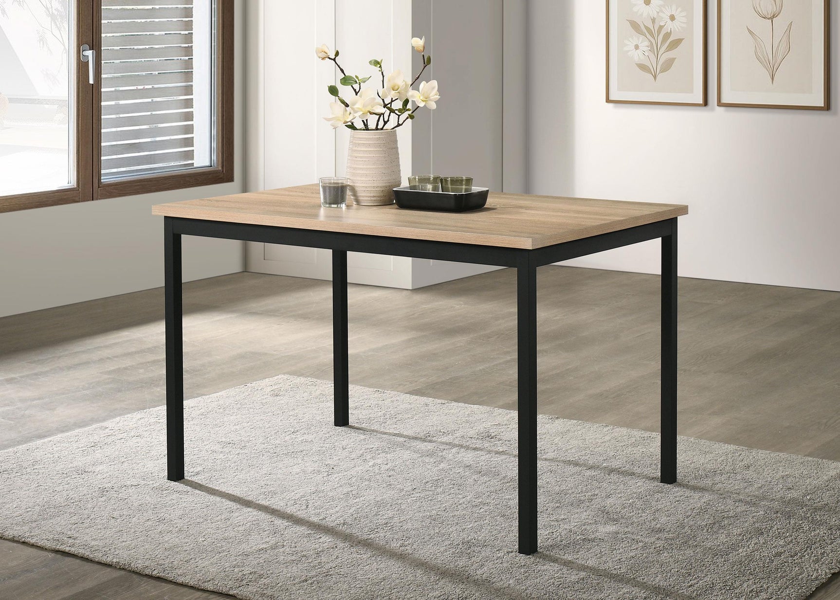 Garza dining table showing metal frame base