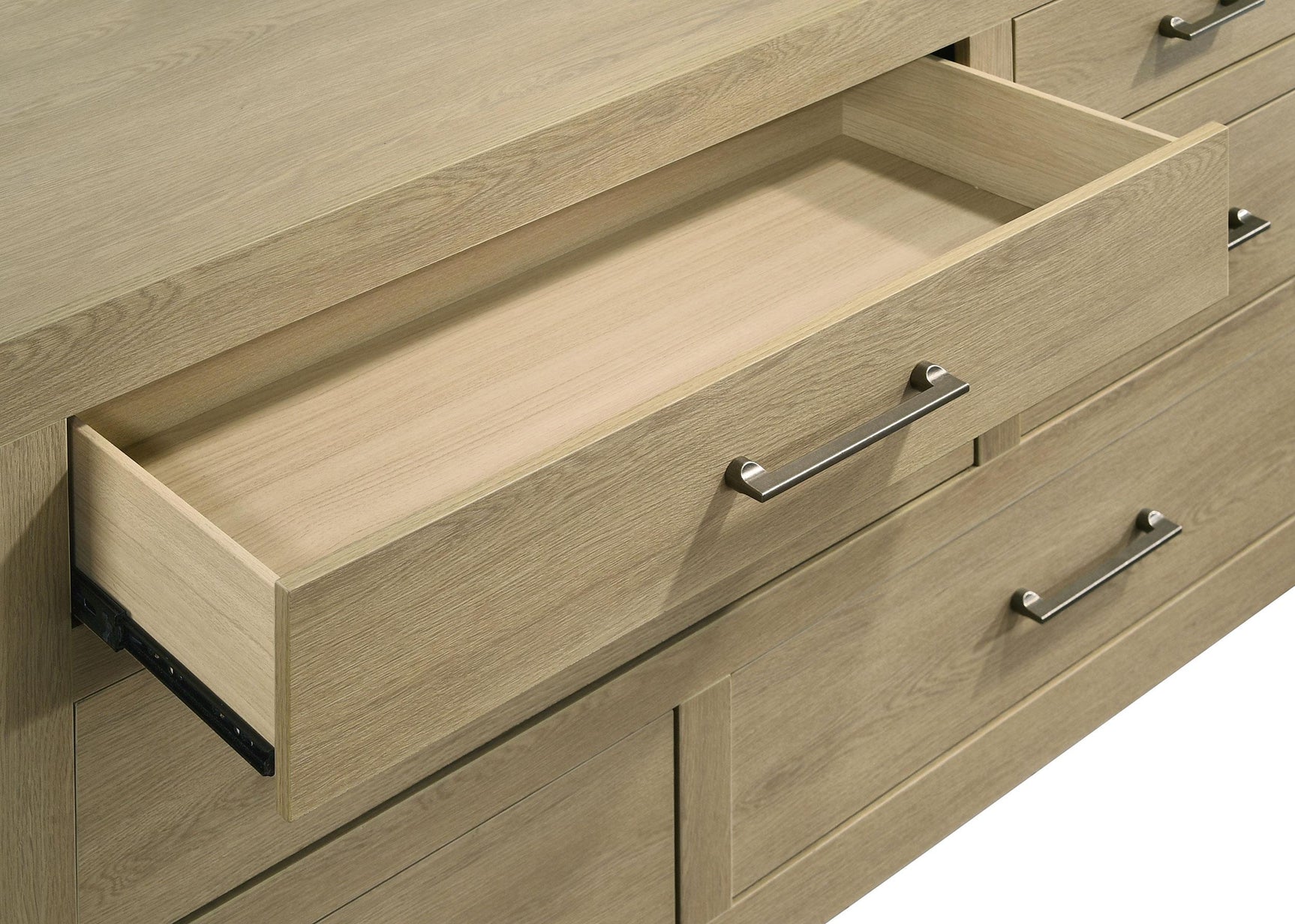 Drawer handle detail with light oak finish background