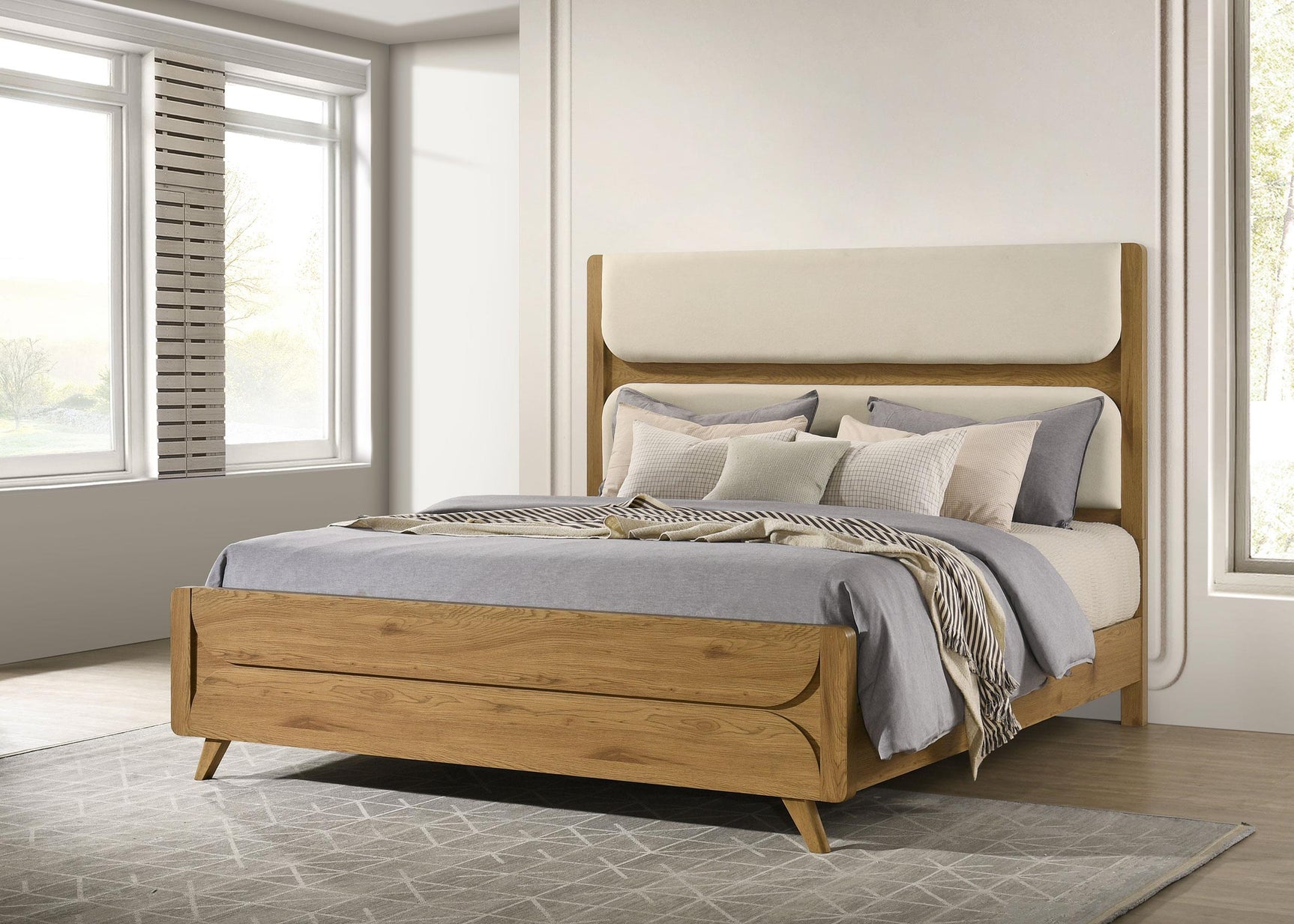 Side angle of Bennett Eastern King Upholstered Panel Bed showing fabric and wood frame