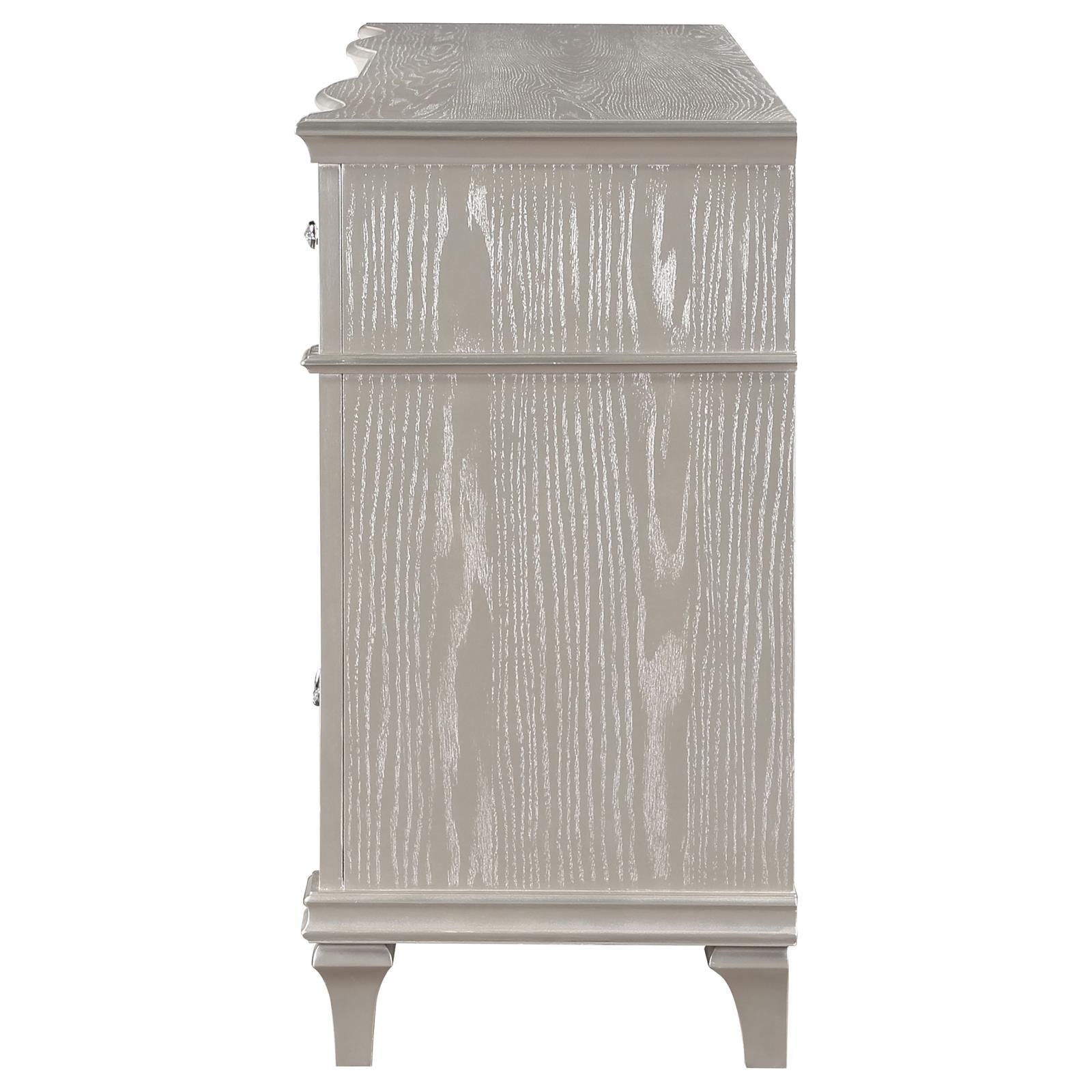 Close-up of curved facade and column panels on dresser front