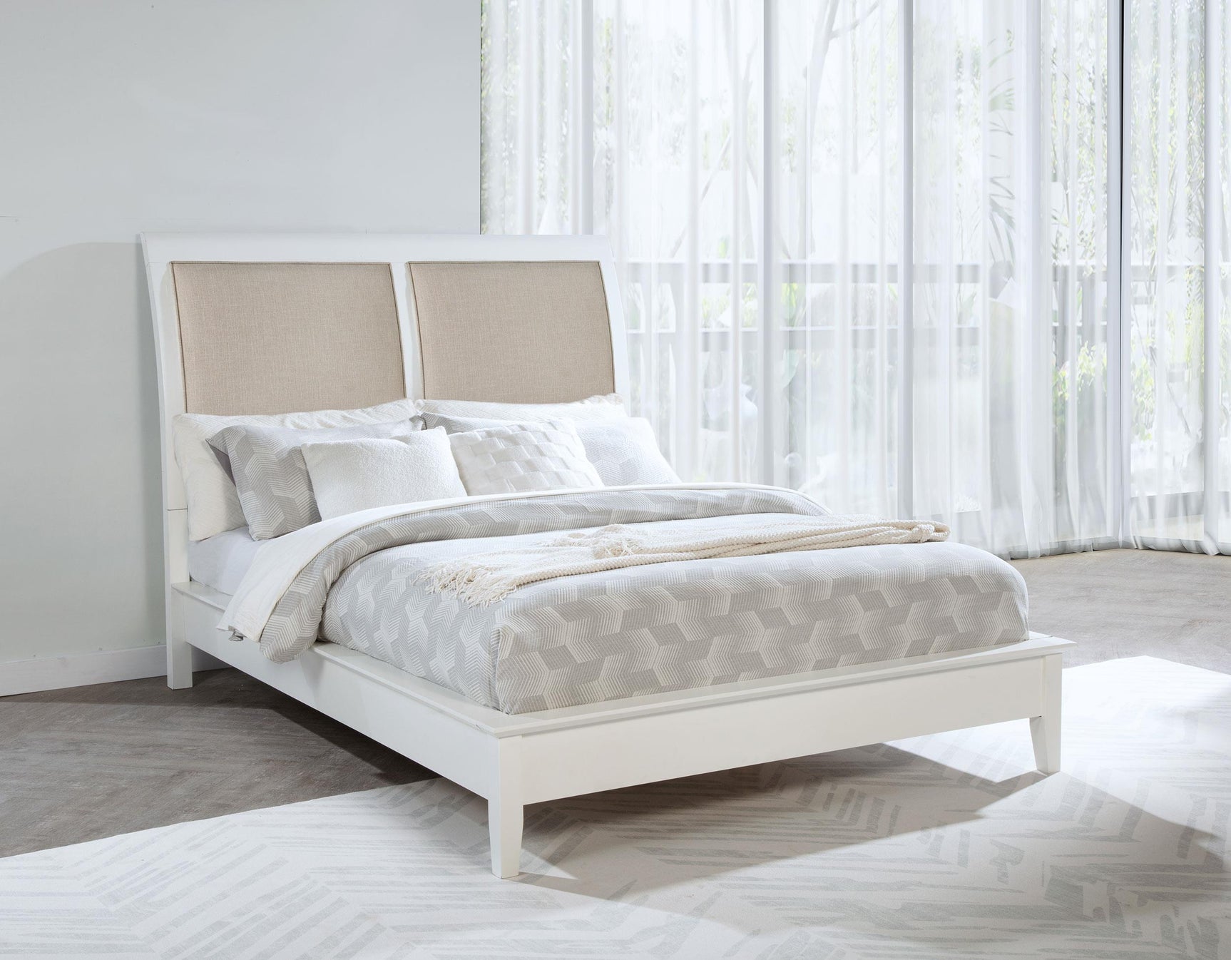 Side view of Bexhill 56-inch king upholstered panel bed with white fabric