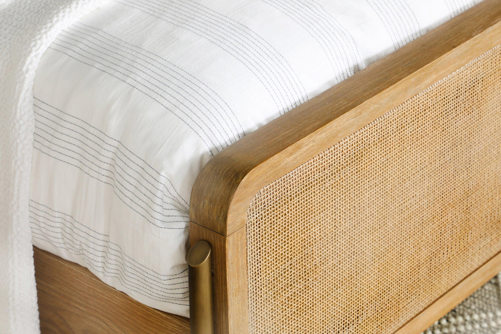 Close-up of woven natural cane panel detail on headboard