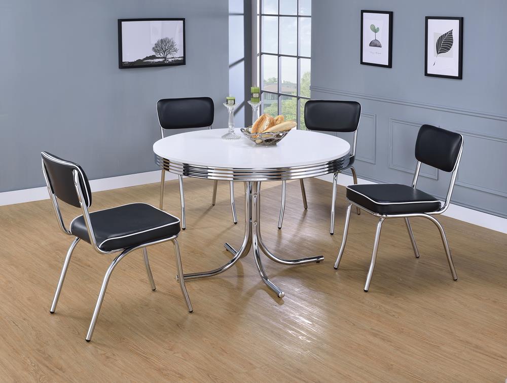 Dining table with chrome rim and metal legs from side angle