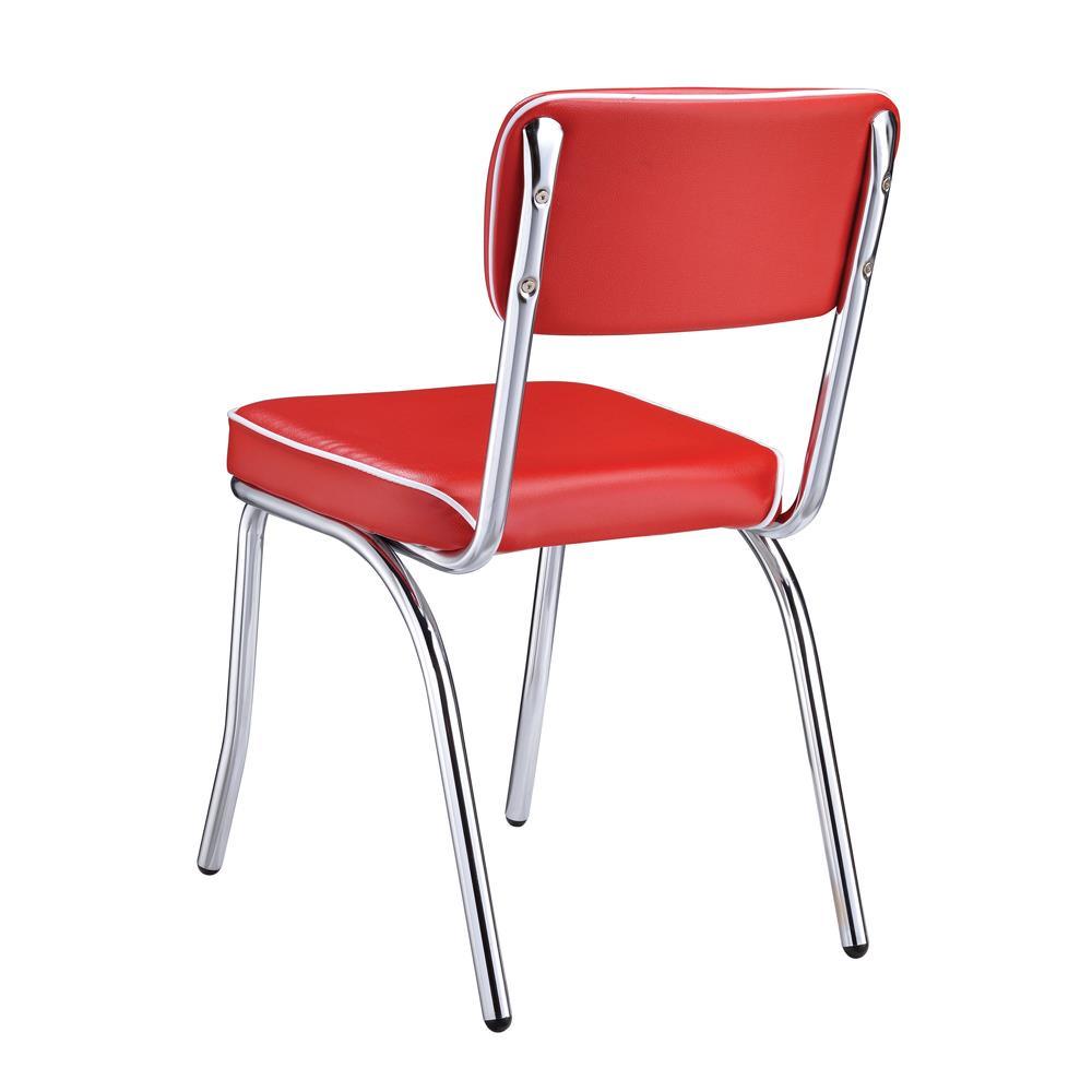 Close-up of red cushioned seat with white piping trim on chrome frame chair