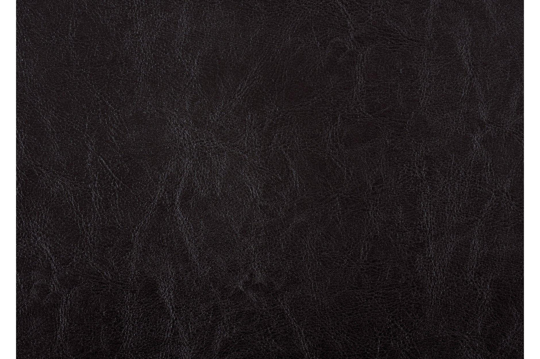 Close-up of table leg and chair with tufted dark brown upholstery