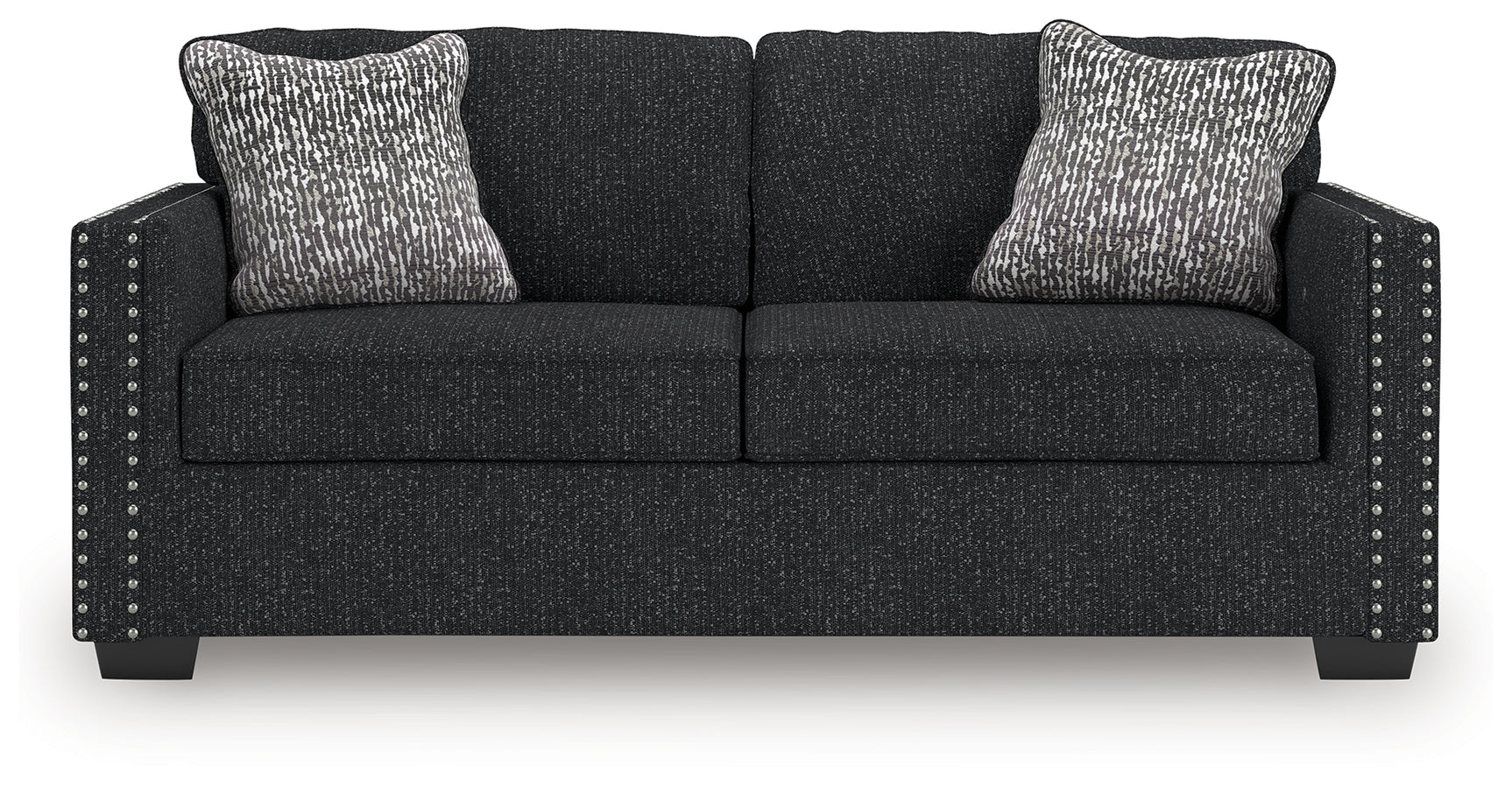 Close-up detail of sofa upholstery and accent nails